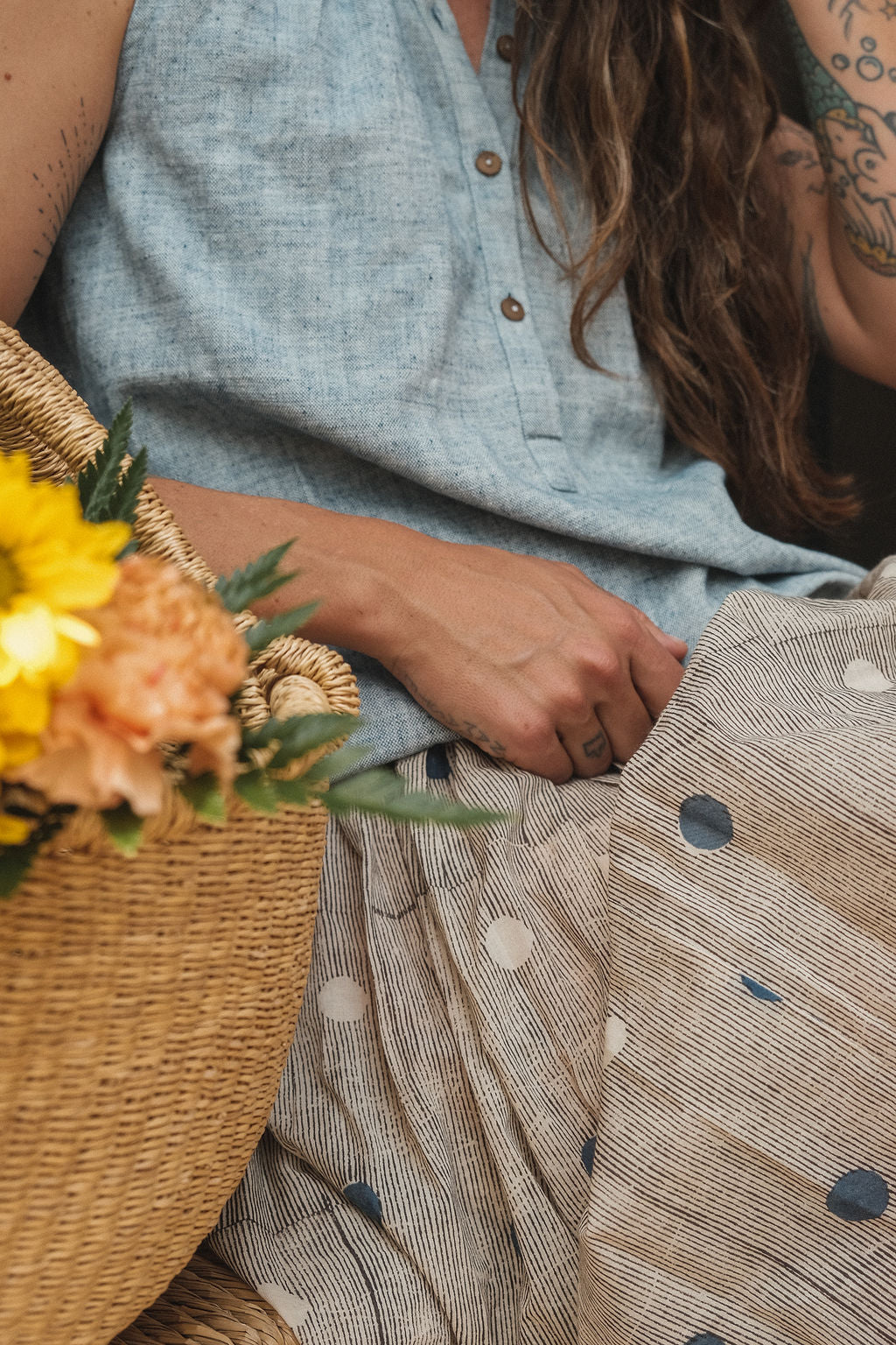 This a gathered skirt with a vintage look. The polka dots add the charm to the skirt, the colors are subtle and soothing to the eyes. The smocked waist gives it an easy closure and comfortable to wear all day.
