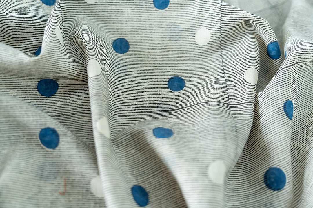 The Blue & White polka dot details of this vintage shirt.