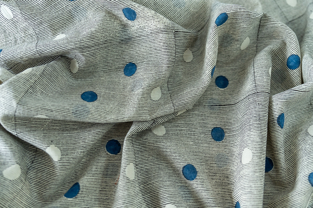 close-up of our vintage skirt - the blue & white polka dots, the black lines in the base of the fabric, giving it a charming and vintage look.
