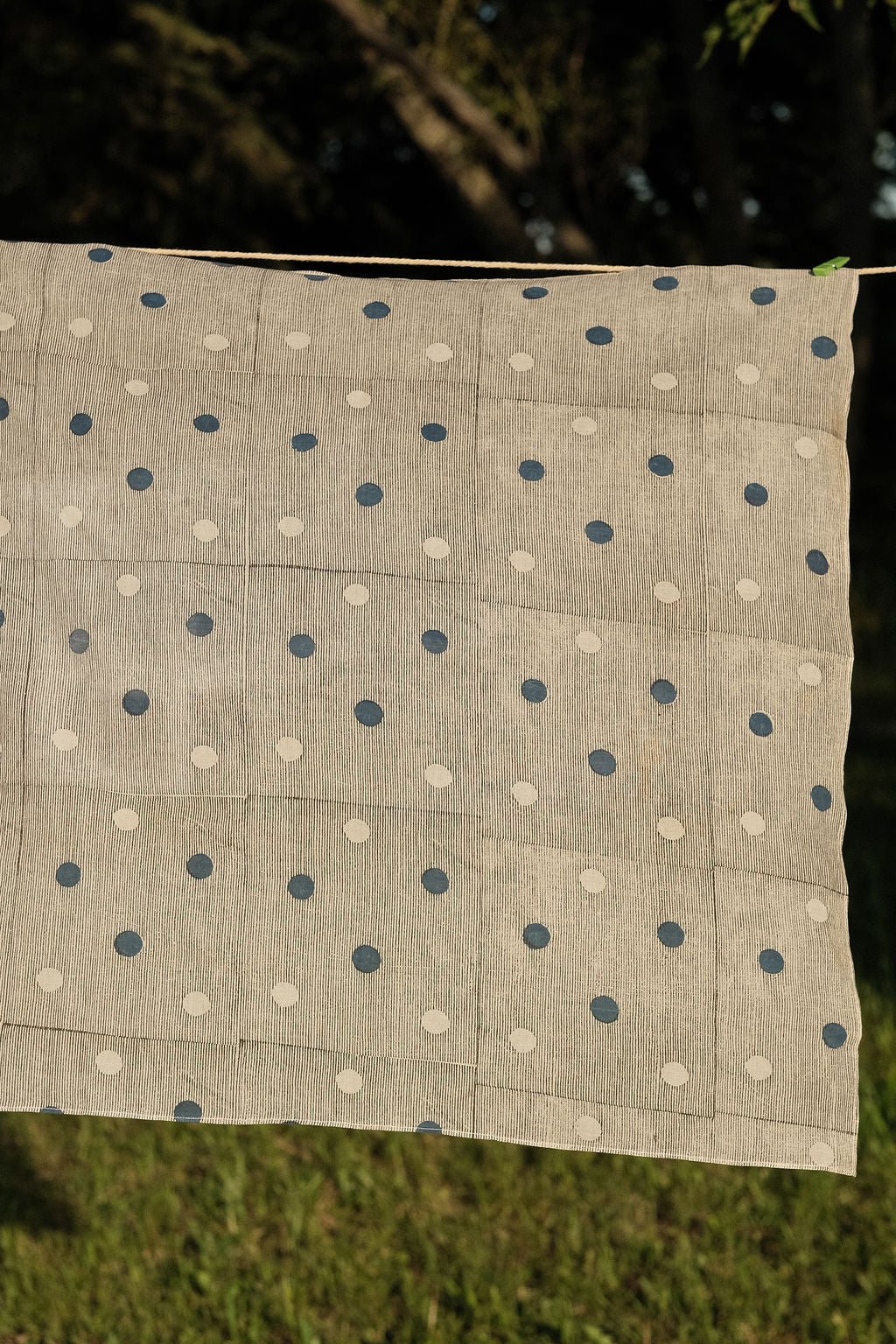 White bandana with scattered blue dot pattern by World of Crow - vintage cotton handkerchief for head wrap and styling.