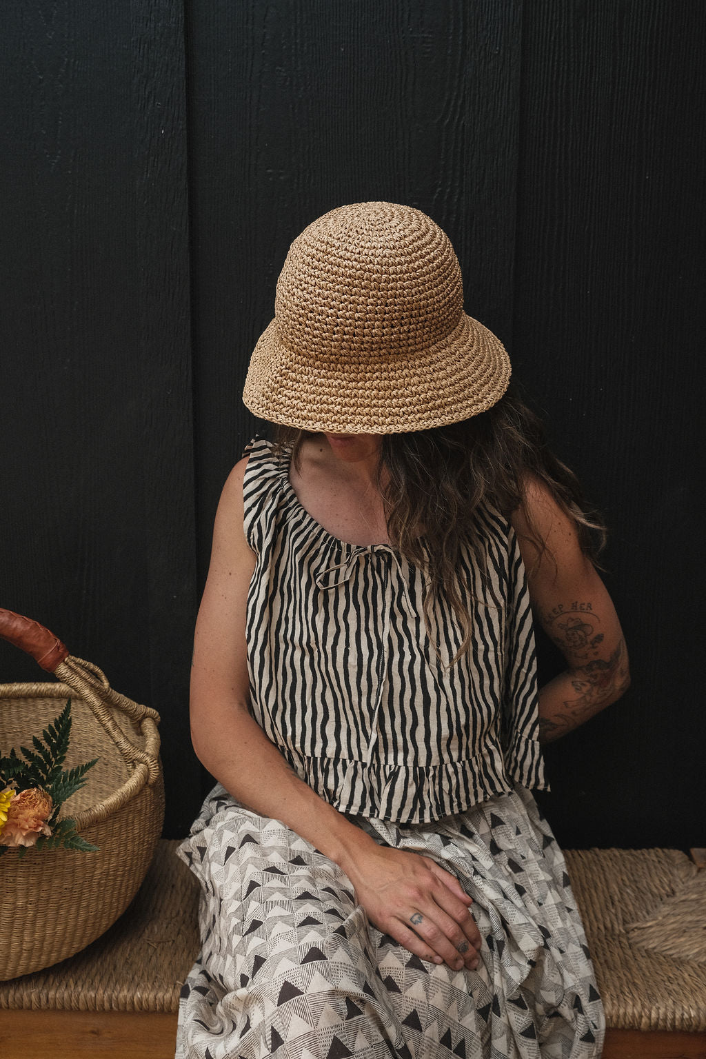 Alice's top is a quintessential top with black & white stripes. The hand-made top features a gathered scoop neckline with a tie detail. The fabric is soft and lightweight making this garment perfect for all day wear.