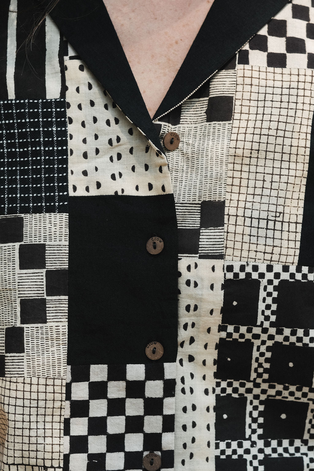 The detailed patchwork of the shirt made by several jamdani patches.