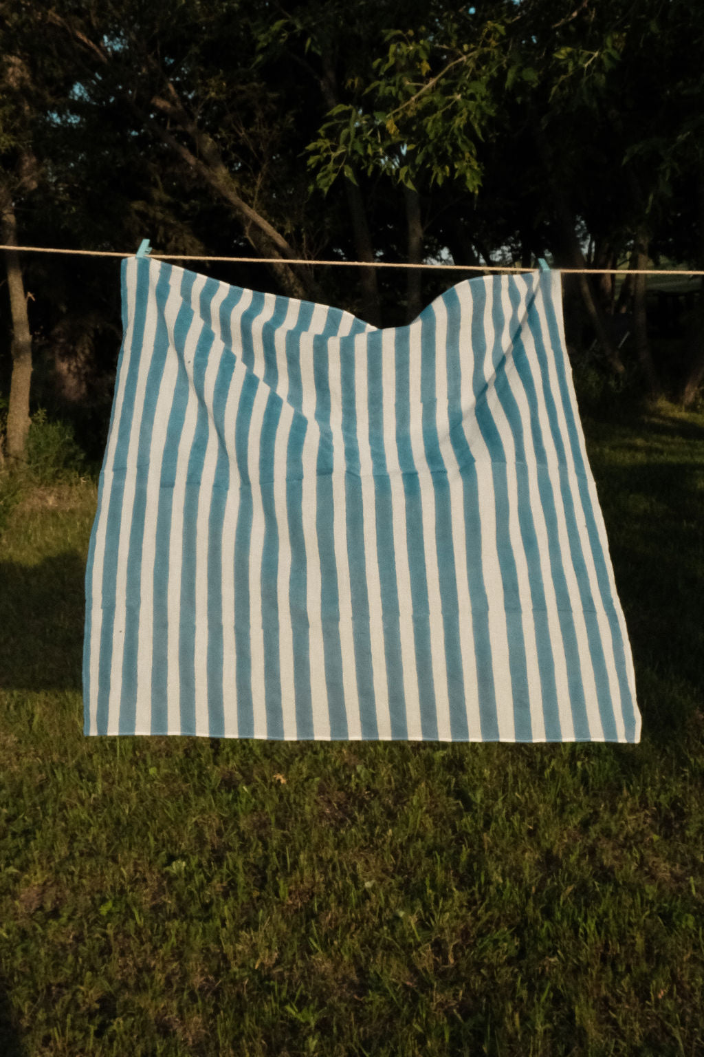 Indigo blue and white vertical striped cotton bandana by World of Crow, handwoven in India using natural dyes and traditional weaving techniques – sustainable unisex accessory for everyday wear.