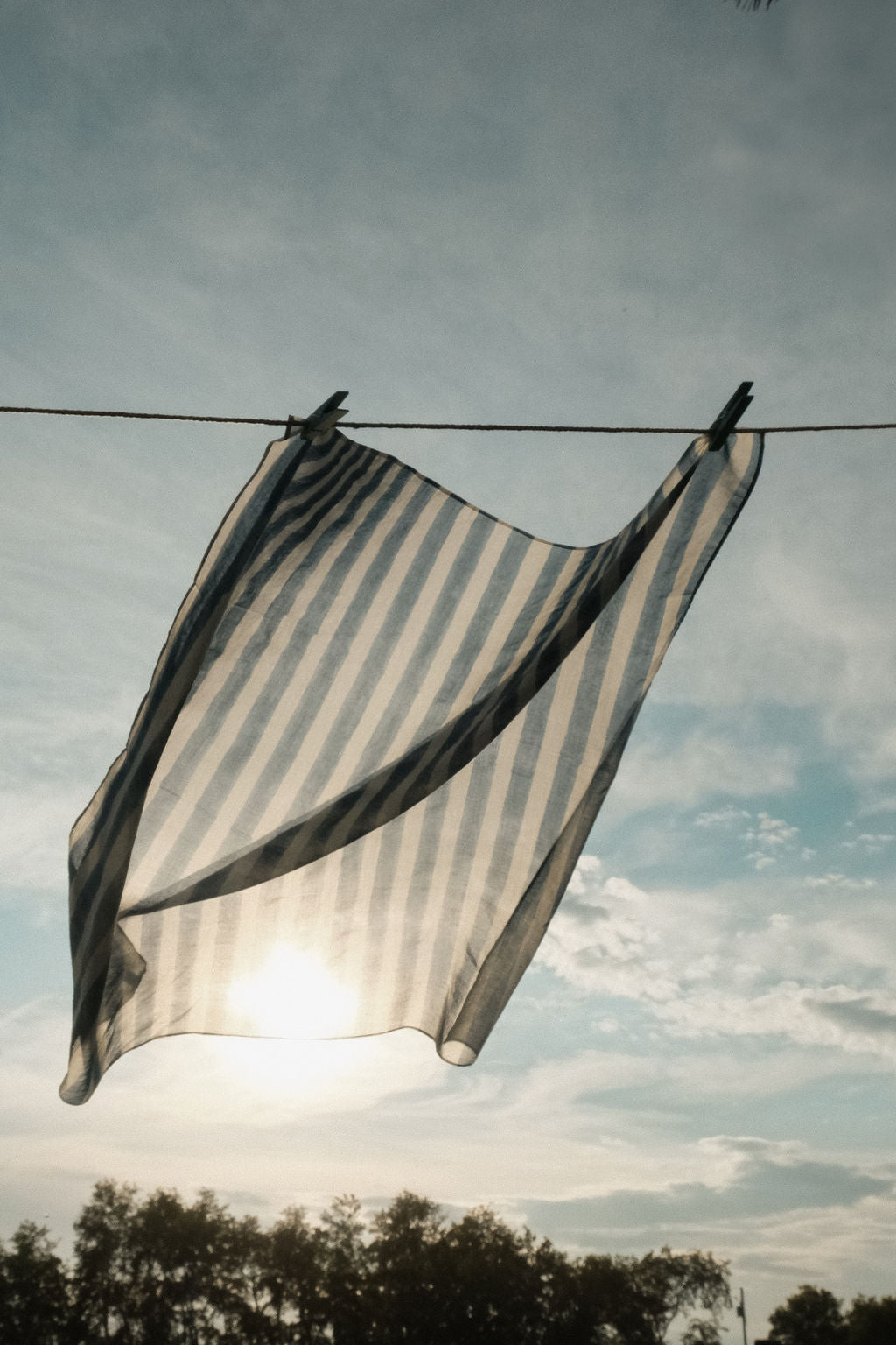 Indigo blue and white vertical striped cotton bandana by World of Crow, handwoven in India using natural dyes and traditional weaving techniques – sustainable unisex accessory for everyday wear.