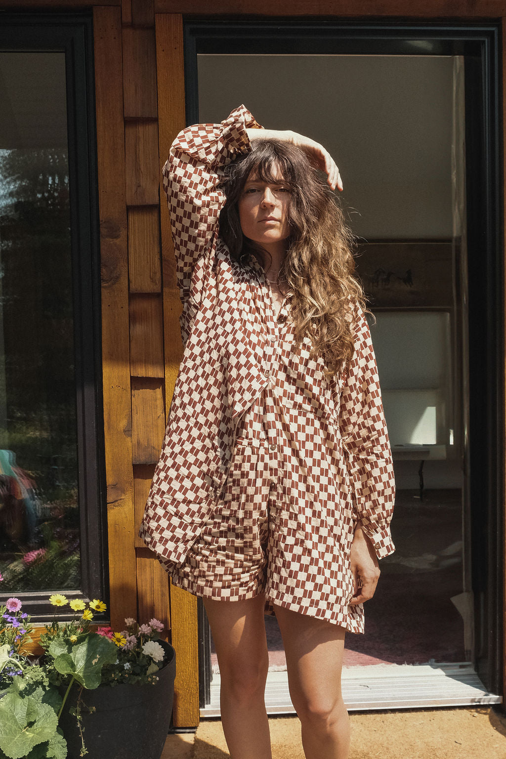 Artist smock crafted from soft, organic cotton, adorned with a hand block-printed design that carries the charm of artisanal craftsmanship. Dyed using gentle, azo-free pigments, the fabric breathes naturally and feels effortless on the skin. Featuring a front button closure and a clean, straight collar, this piece blends tradition with a modern, minimalist silhouette—perfect for thoughtful, everyday dressing. Each smock is one-of-a-kind, echoing the quiet beauty of slow-made fashion.