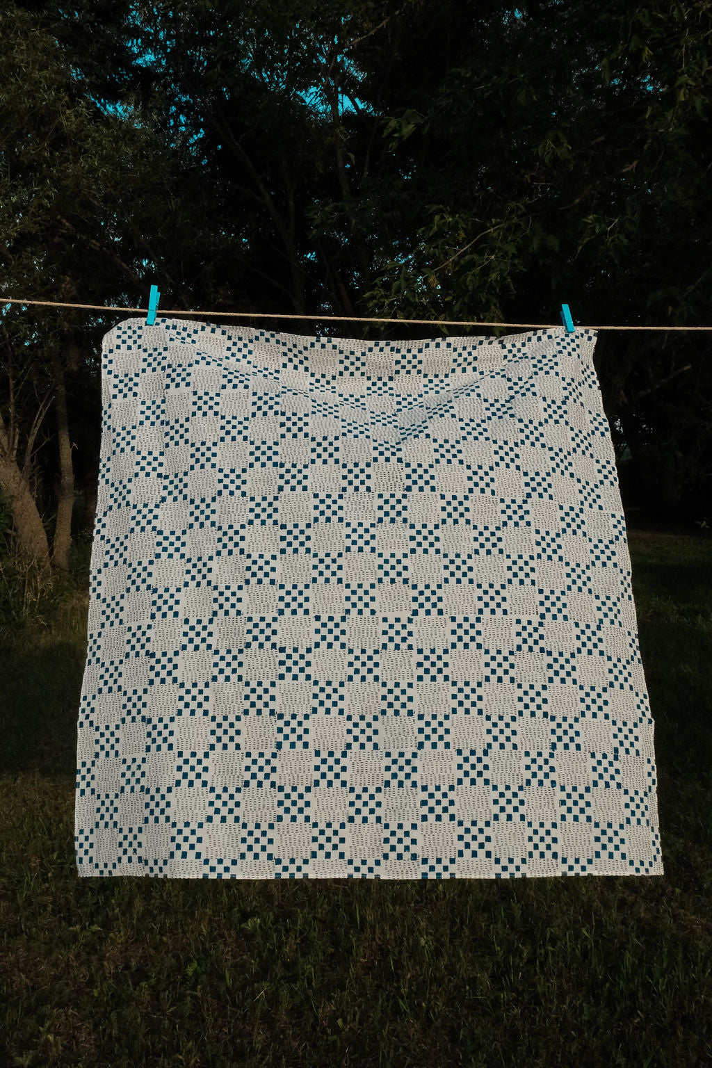 Navy blue and white handwoven checkered cotton bandana by World of Crow, ethically made in India using traditional weaving techniques – sustainable slow fashion accessory for versatile styling.