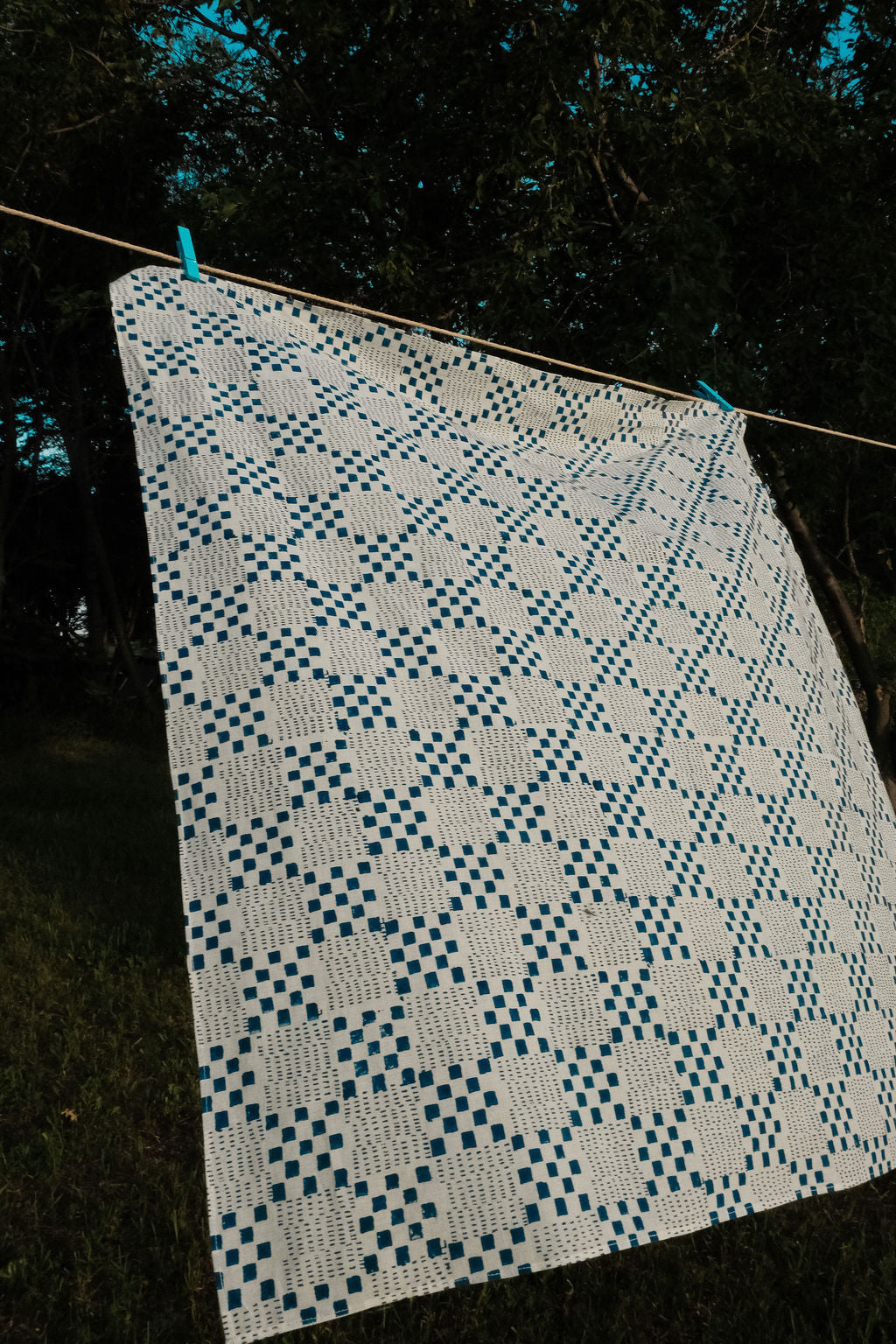 Navy blue and white handwoven checkered cotton bandana by World of Crow, ethically made in India using traditional weaving techniques – sustainable slow fashion accessory for versatile styling.