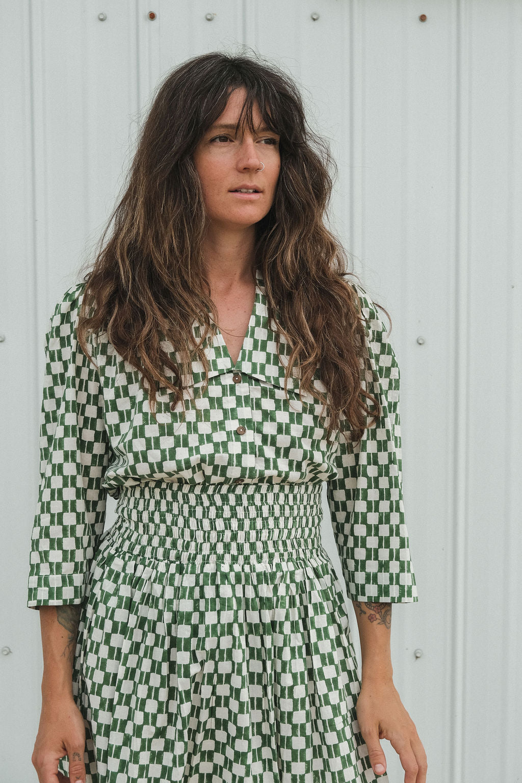 Green and white hand block-printed skirt made from 100% organic cotton, featuring a soft, lightweight fabric with azo-free dyes. Designed with a comfortable elasticated waist, full lining, and side pockets, this ethically made skirt falls 36” from the waist and fits true to size with a relaxed drape over the hips and legs. Each piece is uniquely handcrafted, with natural variations in color and pattern that reflect its artisanal charm—ideal for effortless, everyday wear.