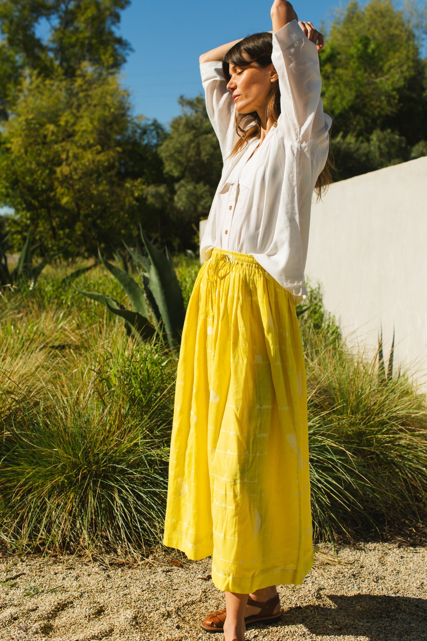 This Lemon Sorbet Skirt is made in collaboration between Erica Kim @ahistoryofarchitecture and World of Crow, it has a yellow color, checks detailing, jamdani fabric, ankle length skirt