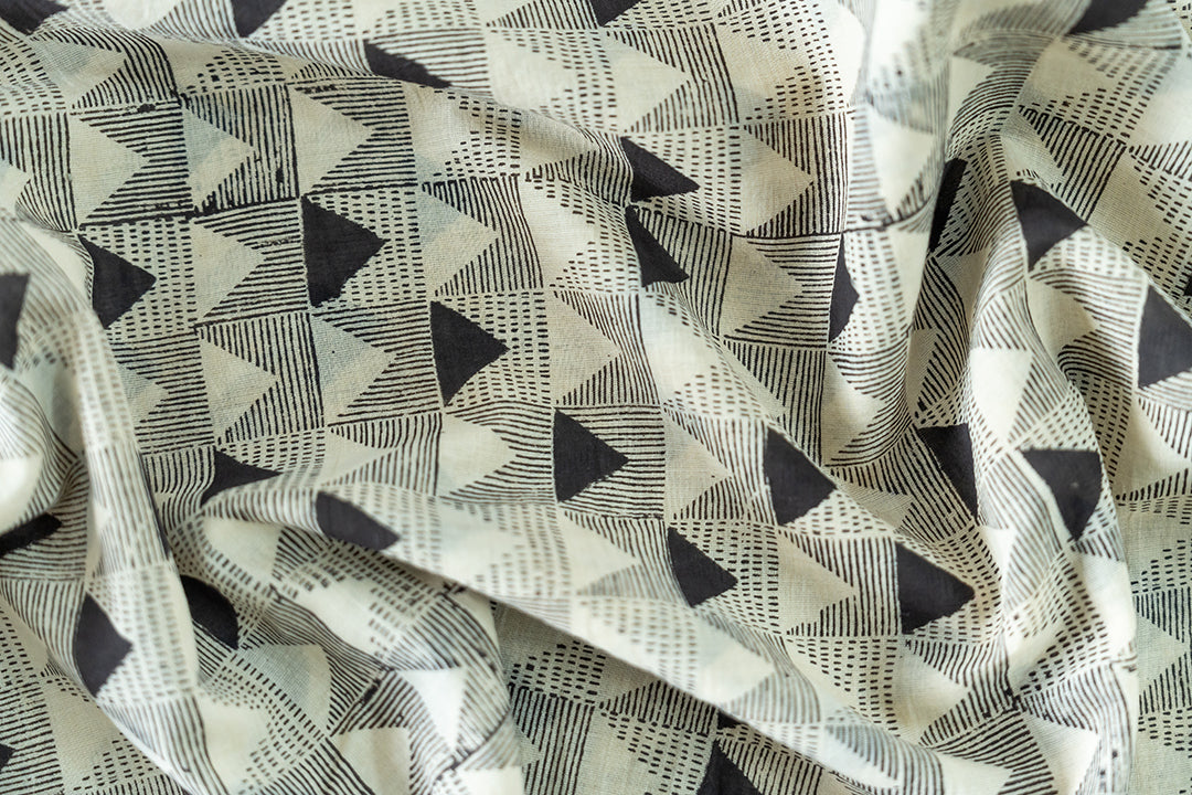 close-up of the skirt featuring the triangular hand-block print and the soothing natural dyes.