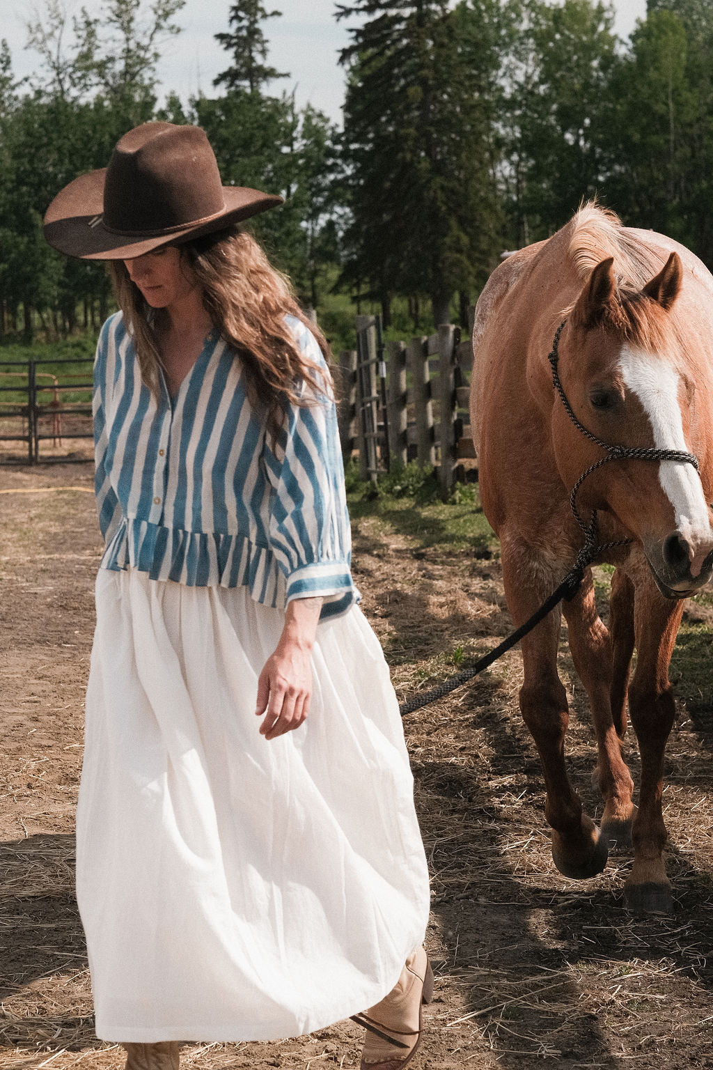 White handwoven cotton skirt featuring a soft, lightweight feel and crafted with azo-free dyes. Ethically made with full lining and functional side pockets, this skirt falls 36” from the waist and features an elasticated waistband for a relaxed fit over the hips and legs. The breathable, non-stretchy fabric ensures comfort for everyday wear. Each piece is one-of-a-kind, with subtle variations that highlight the artisanal block-printing process. Fits true to size—ideal for conscious, timeless dressing.