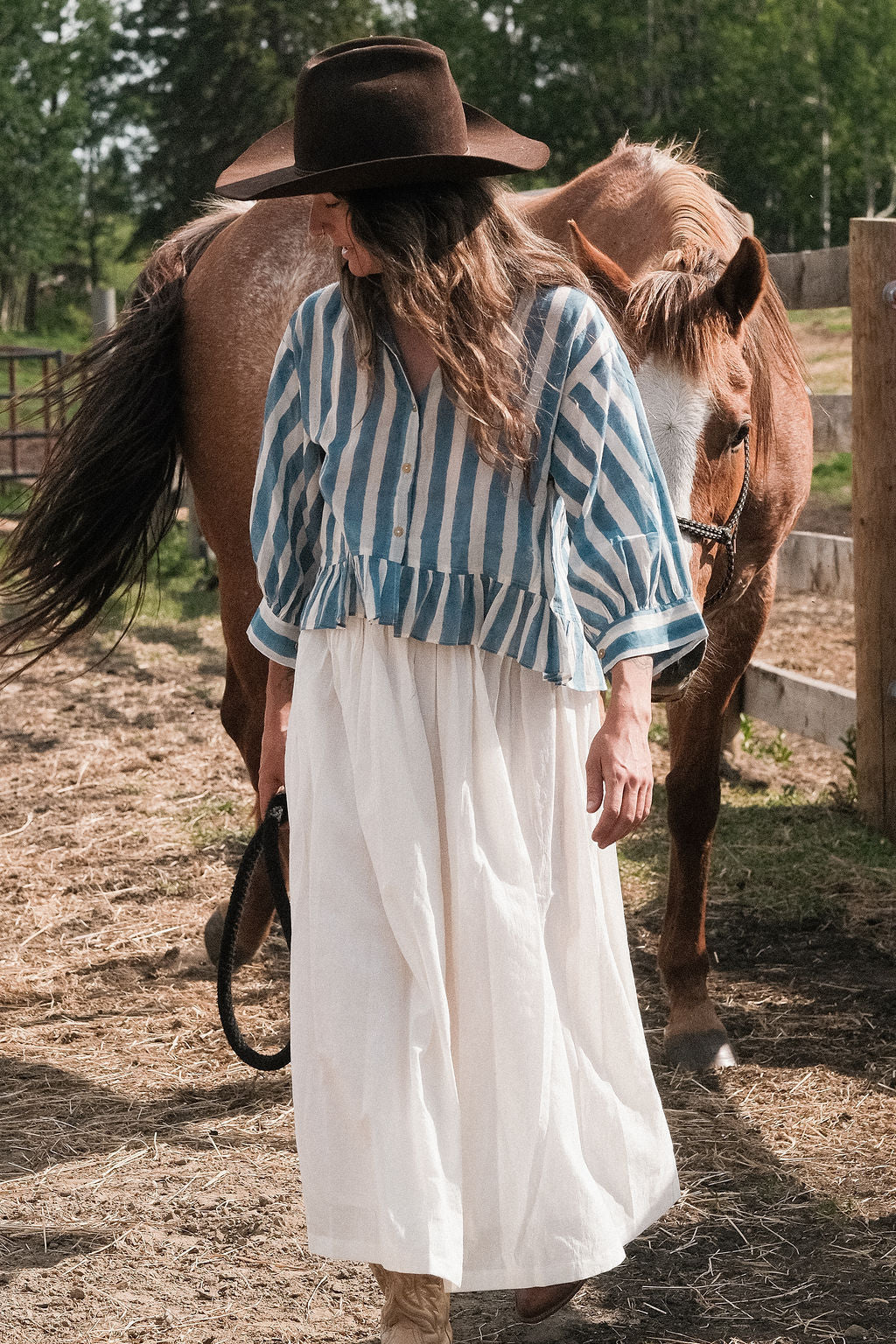 White handwoven cotton skirt featuring a soft, lightweight feel and crafted with azo-free dyes. Ethically made with full lining and functional side pockets, this skirt falls 36” from the waist and features an elasticated waistband for a relaxed fit over the hips and legs. The breathable, non-stretchy fabric ensures comfort for everyday wear. Each piece is one-of-a-kind, with subtle variations that highlight the artisanal block-printing process. Fits true to size—ideal for conscious, timeless dressing.