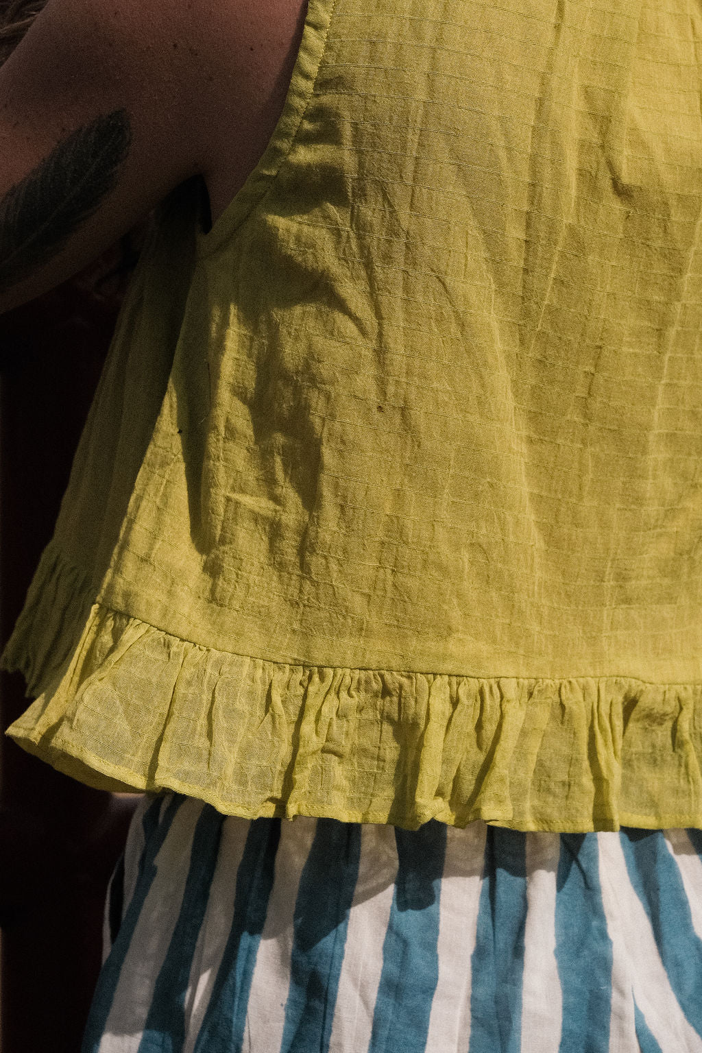 close-up of our parrot green top.