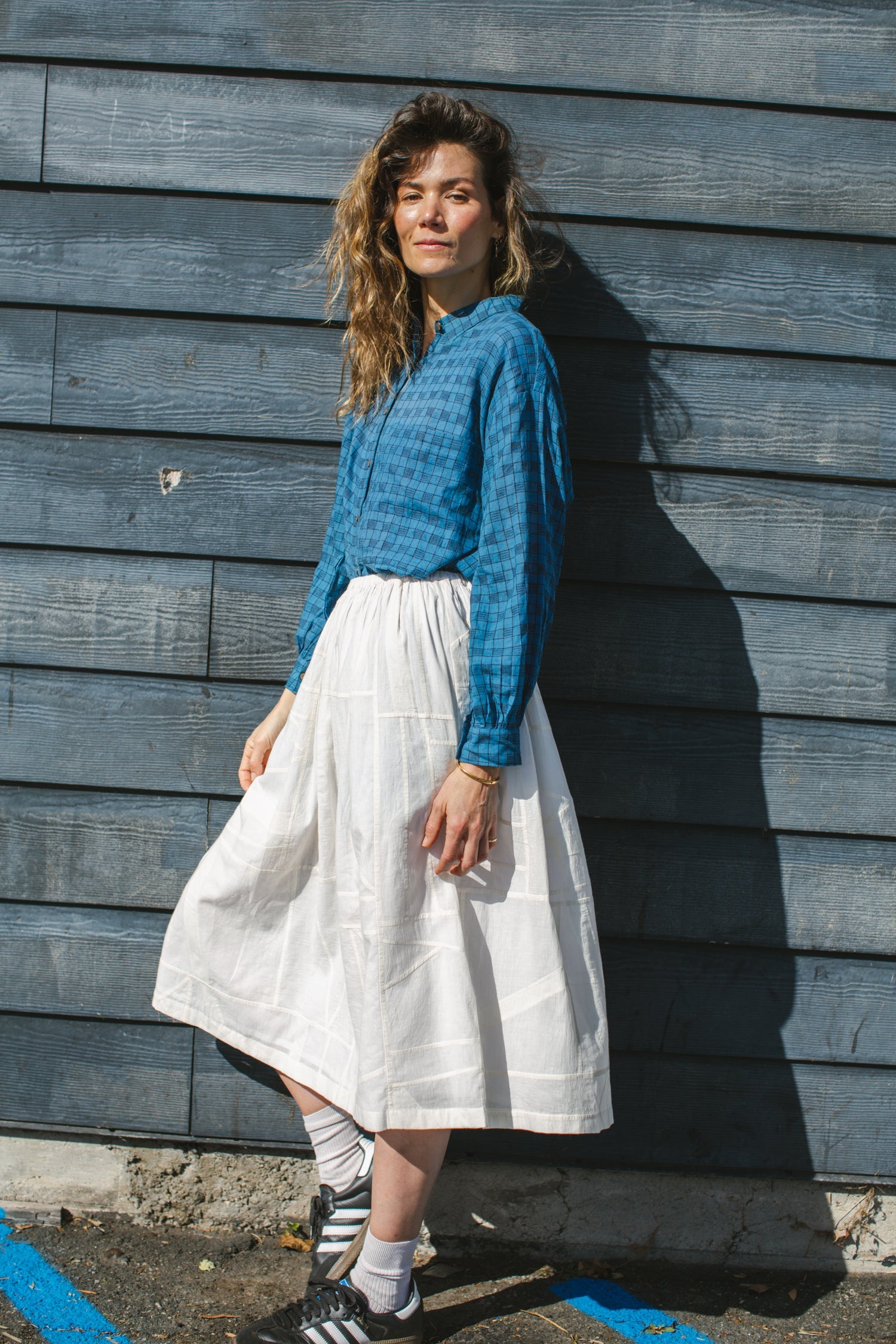 Blue long-sleeve button-down shirt with a subtle textured pattern. Features a classic pointed collar and a relaxed fit, perfect for effortless styling. Made from breathable fabric for all-day comfort. Ideal for casual and semi-formal looks.