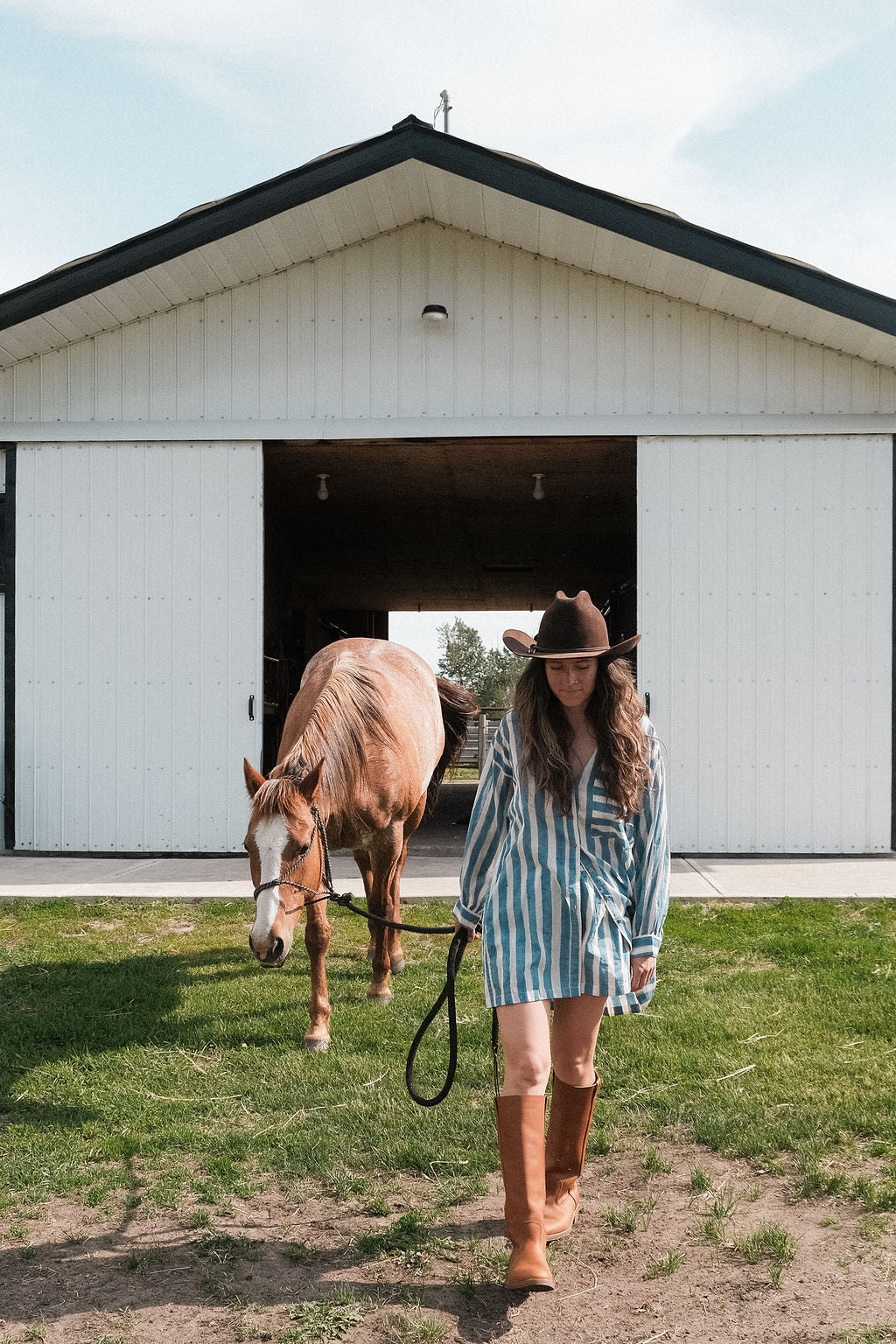 This summer blue artist smock  has vertical blue and white stripes, classic collar, and a chest pocket with contrasting horizontal stripes. Made with soft cotton fabric and natural color.