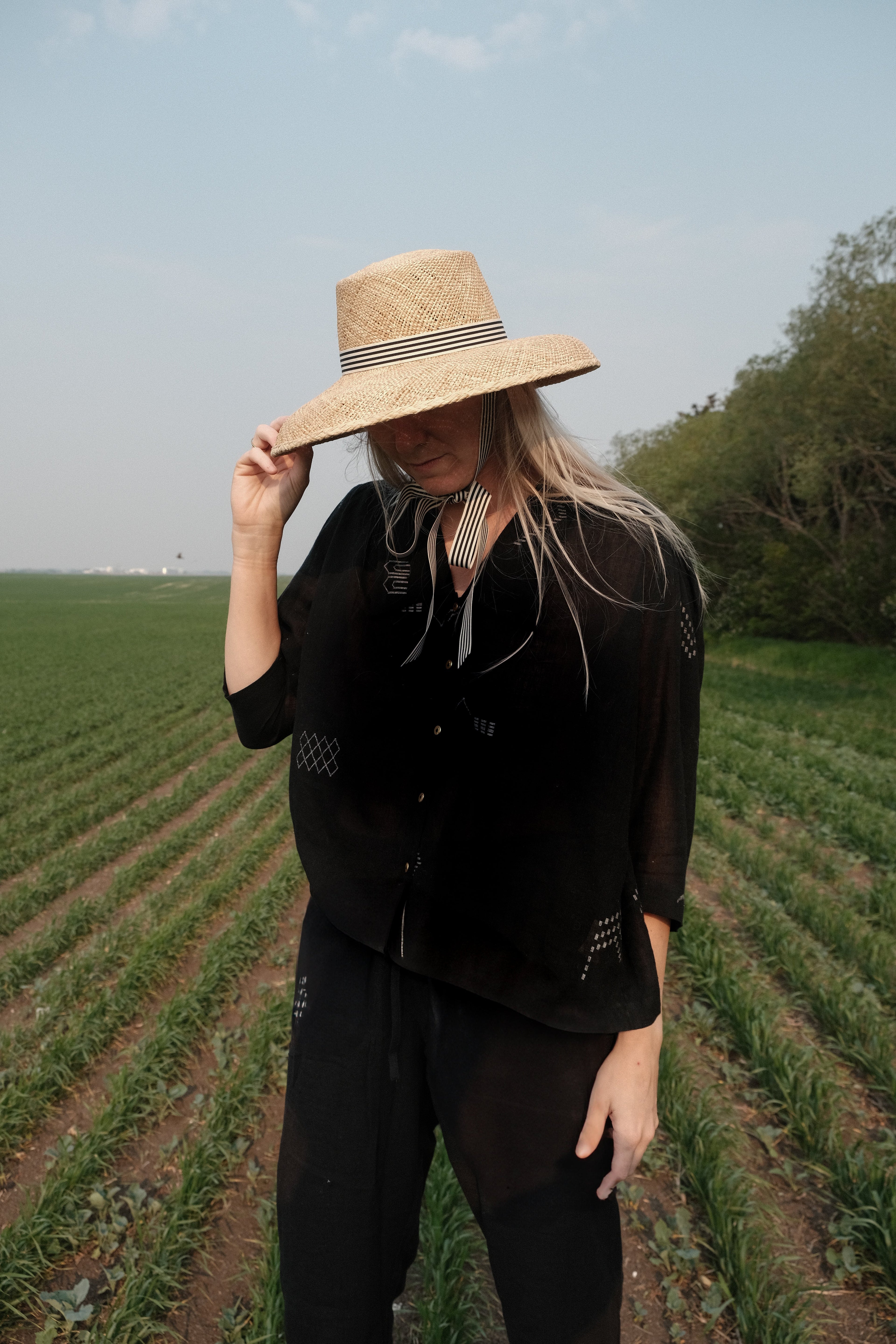 Black handwoven cotton top made from soft, lightweight fabric dyed with azo-free dyes. Ethically crafted with a breathable, non-stretchy texture that drapes effortlessly. Falls 25” from the shoulder and fits true to size, offering a relaxed yet structured silhouette. Ideal for everyday wear, this minimalist top combines timeless style with sustainable craftsmanship.