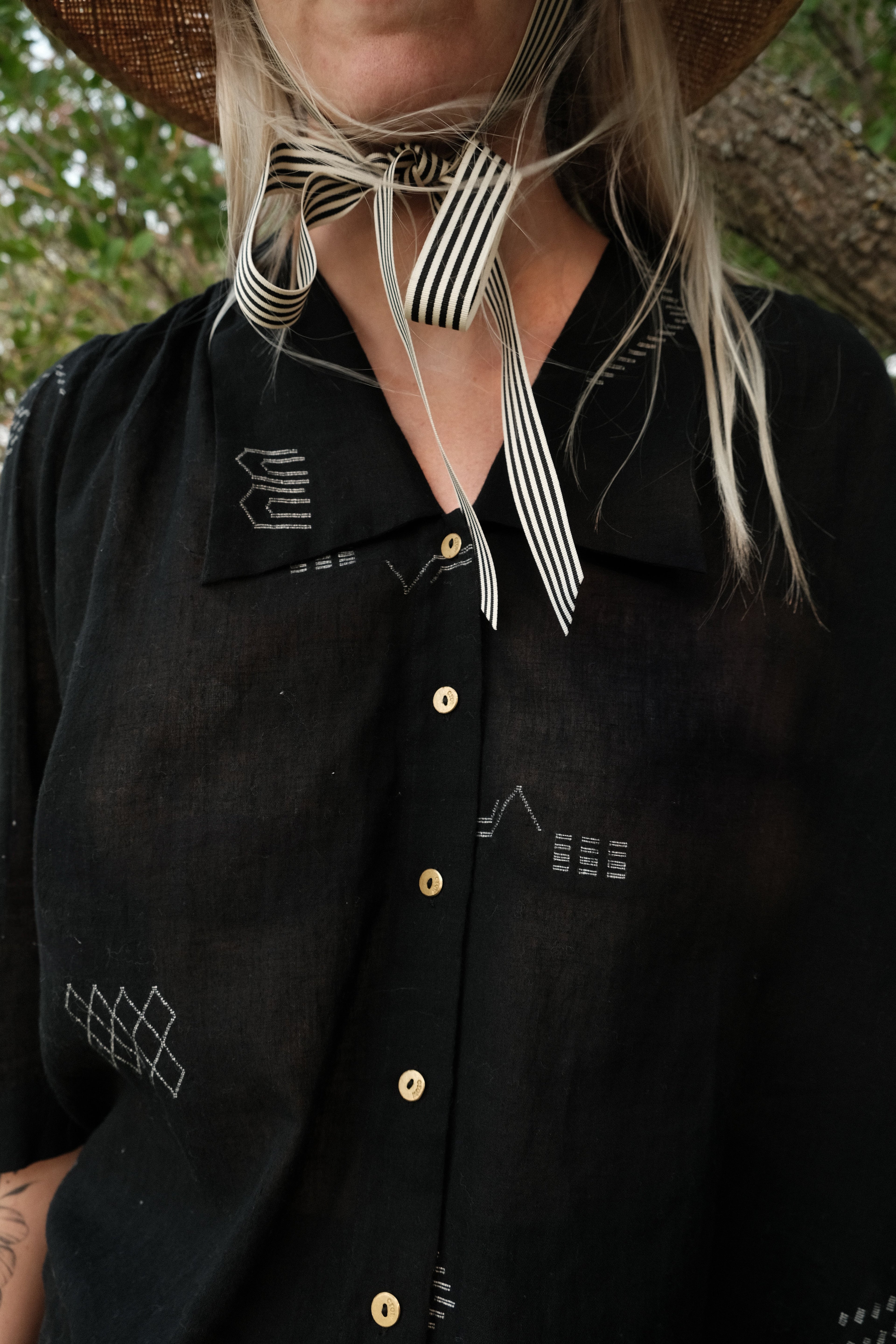 Black handwoven cotton top made from soft, lightweight fabric dyed with azo-free dyes. Ethically crafted with a breathable, non-stretchy texture that drapes effortlessly. Falls 25” from the shoulder and fits true to size, offering a relaxed yet structured silhouette. Ideal for everyday wear, this minimalist top combines timeless style with sustainable craftsmanship.