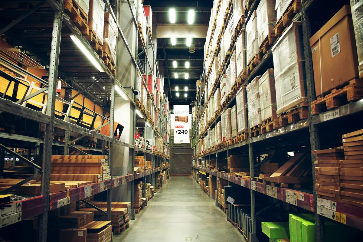 A long aisle of stocked warehouse shelves