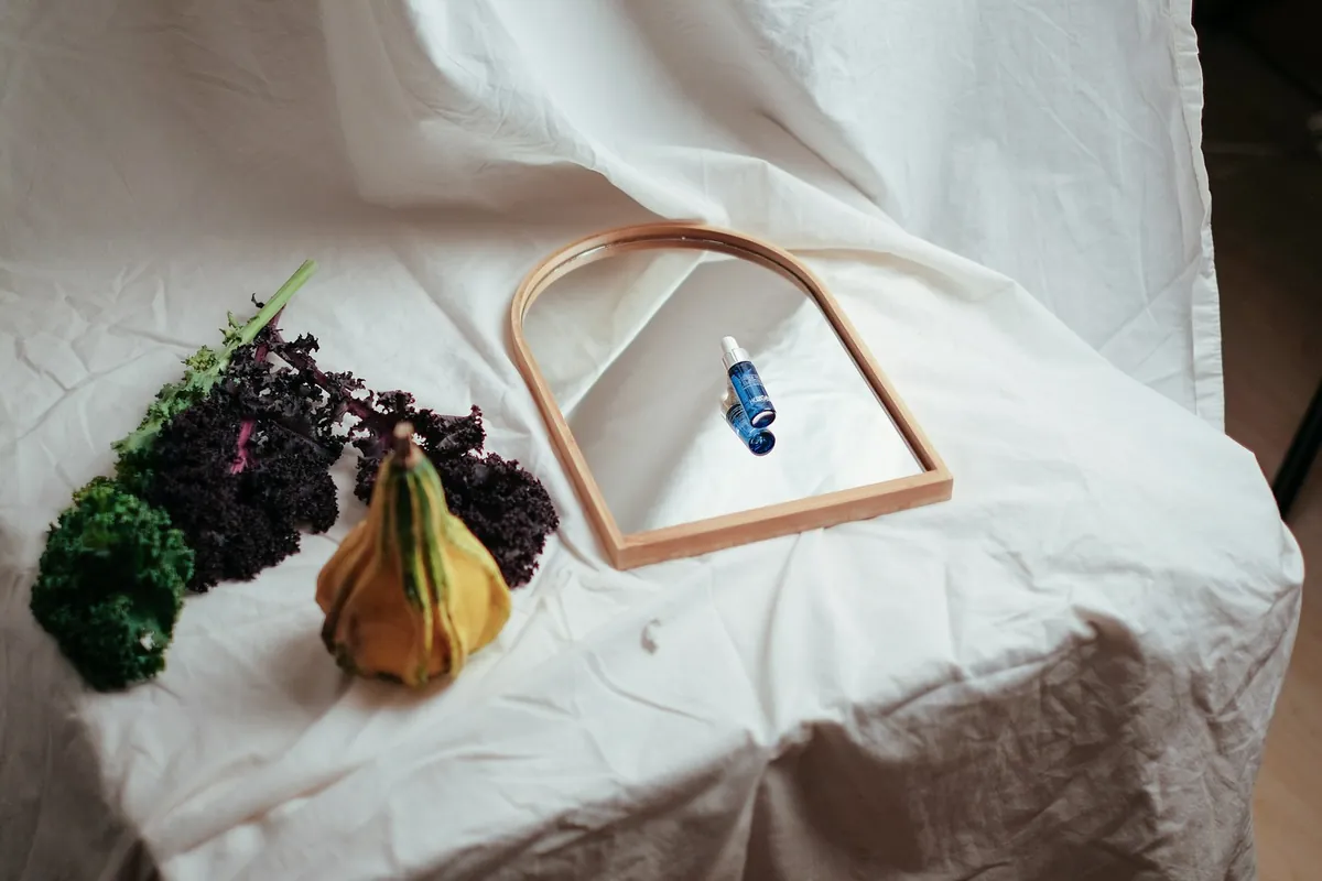 A styled product shot on draped white fabric
