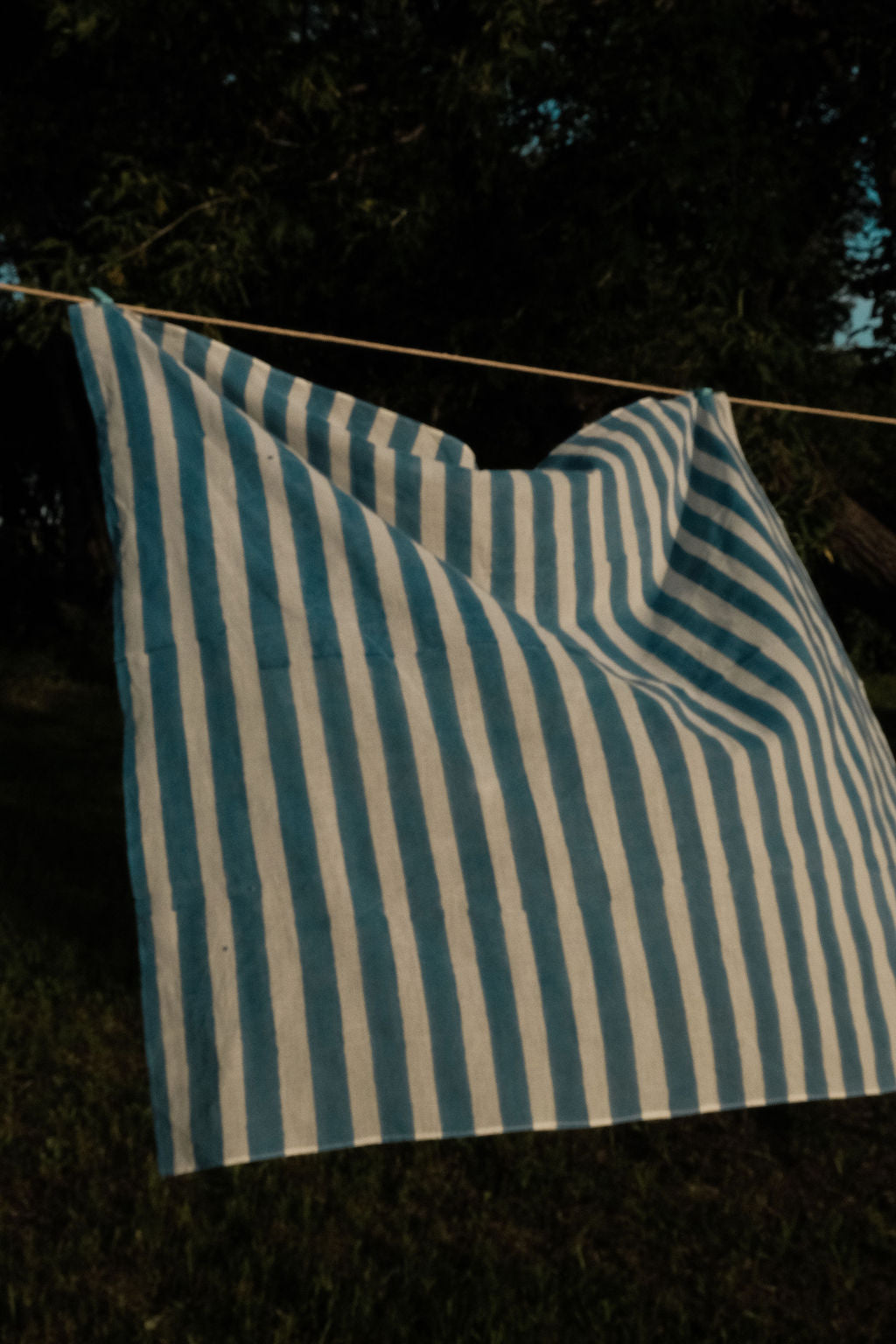 Indigo blue and white vertical striped cotton bandana by World of Crow, handwoven in India using natural dyes and traditional weaving techniques – sustainable unisex accessory for everyday wear.