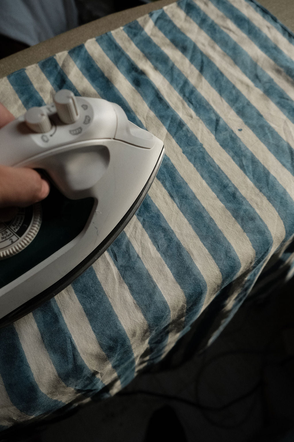 Indigo blue and white vertical striped cotton bandana by World of Crow, handwoven in India using natural dyes and traditional weaving techniques – sustainable unisex accessory for everyday wear.