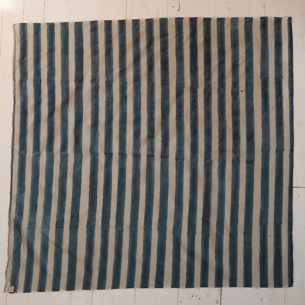 Indigo blue and white vertical striped cotton bandana by World of Crow, handwoven in India using natural dyes and traditional weaving techniques – sustainable unisex accessory for everyday wear.