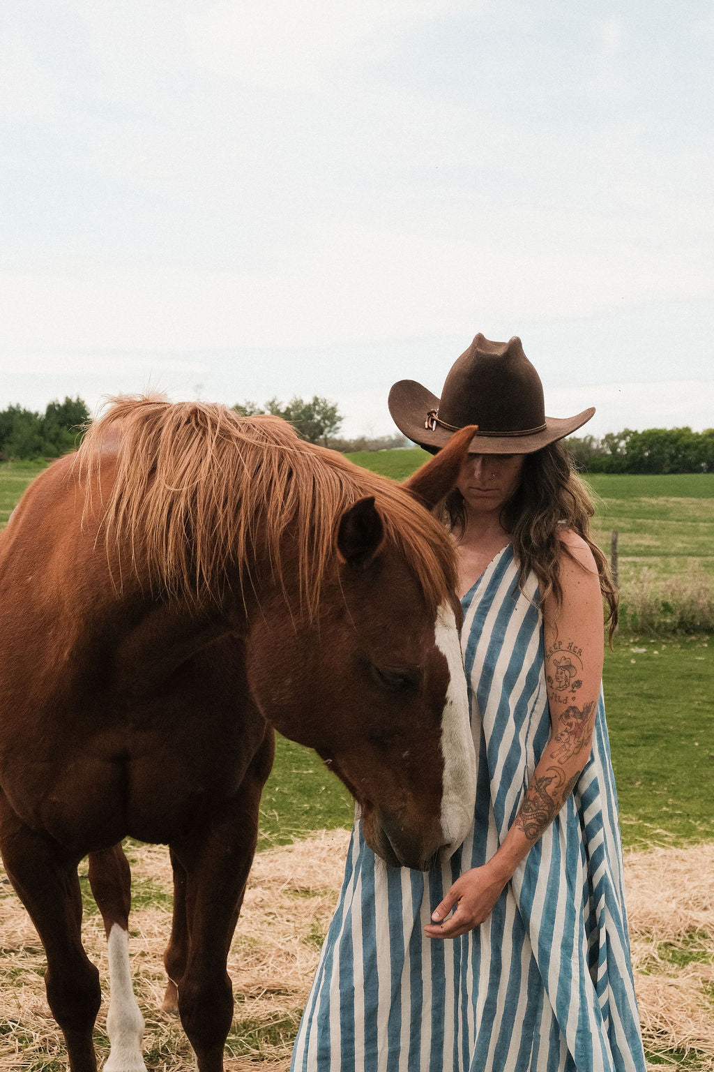 Sleeveless blue & white striped, hand woven cotton dress. The A-line silhouette and midi length at the charm to the dress. It has a V-neck adding the feminine touch to the bespoke piece. 