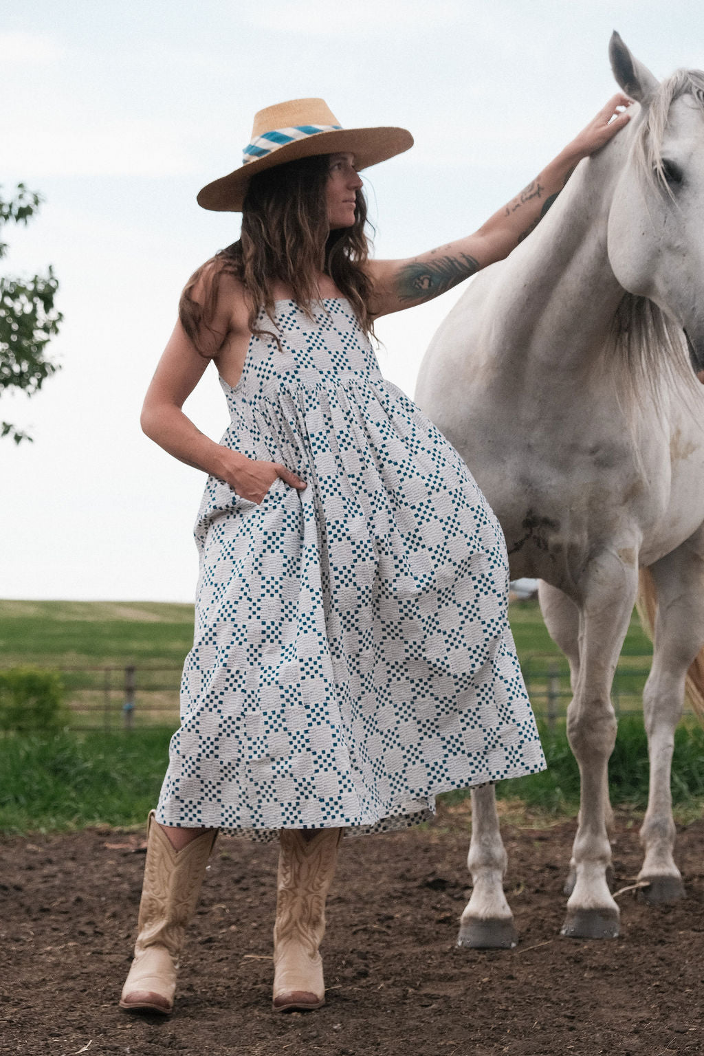White and indigo blue hand block-printed dress made from 100% organic cotton, crafted with azo-free dyes for a soft and breathable feel. Ethically made with a lightweight, non-stretchy fabric, the dress falls 45” from the shoulder in size S and offers a true-to-size fit. Each garment is uniquely one-of-a-kind, with natural variations in color and pattern that highlight its handcrafted charm—perfect for conscious, everyday dressing.