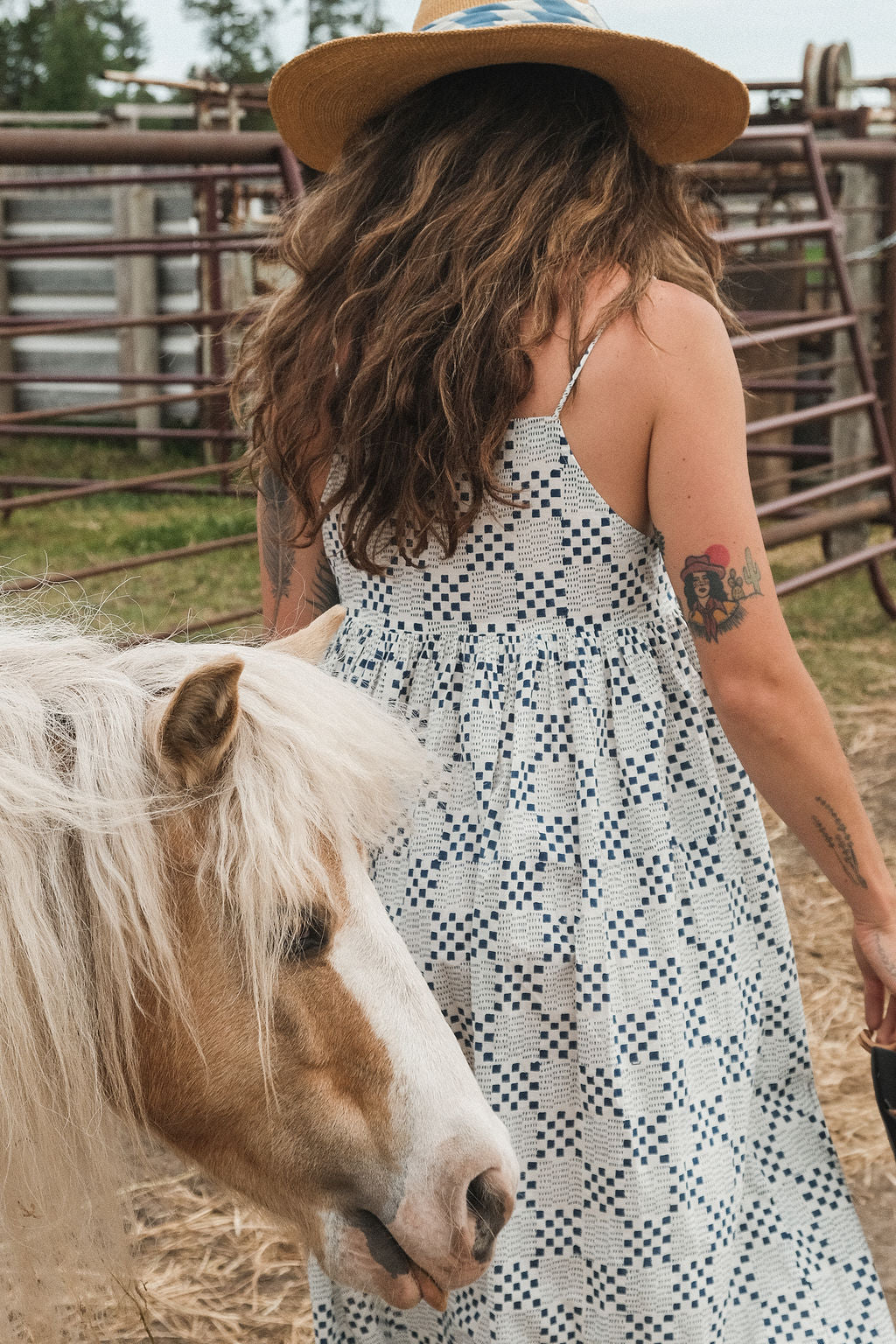 White and indigo blue hand block-printed dress made from 100% organic cotton, crafted with azo-free dyes for a soft and breathable feel. Ethically made with a lightweight, non-stretchy fabric, the dress falls 45” from the shoulder in size S and offers a true-to-size fit. Each garment is uniquely one-of-a-kind, with natural variations in color and pattern that highlight its handcrafted charm—perfect for conscious, everyday dressing.