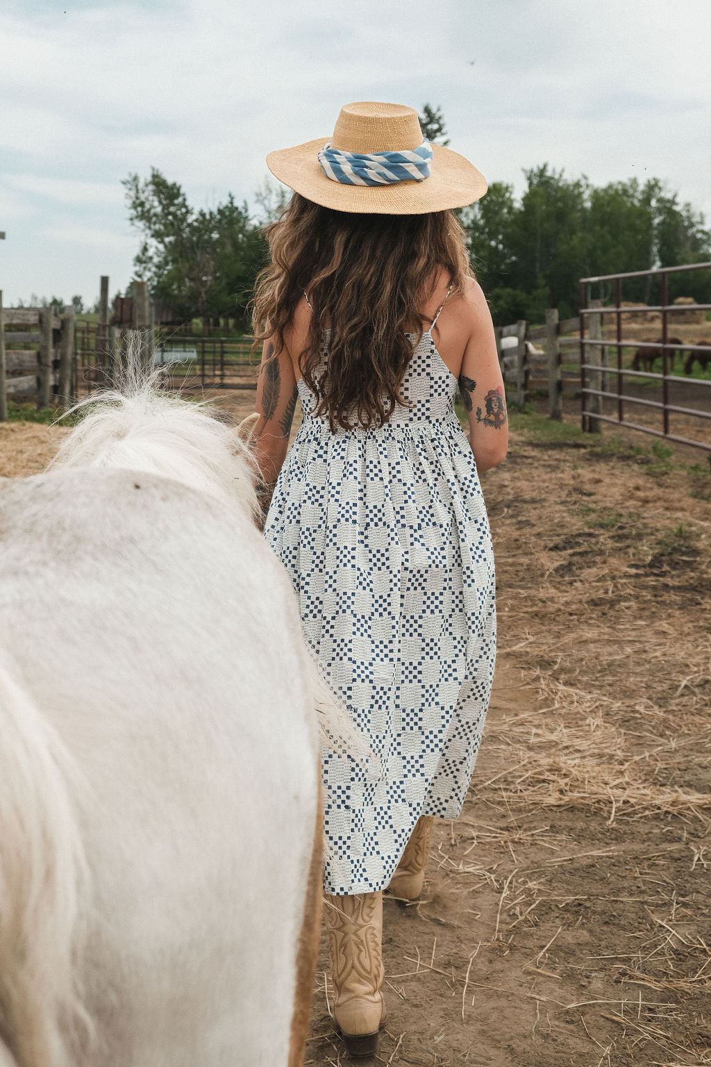 White and indigo blue hand block-printed dress made from 100% organic cotton, crafted with azo-free dyes for a soft and breathable feel. Ethically made with a lightweight, non-stretchy fabric, the dress falls 45” from the shoulder in size S and offers a true-to-size fit. Each garment is uniquely one-of-a-kind, with natural variations in color and pattern that highlight its handcrafted charm—perfect for conscious, everyday dressing.