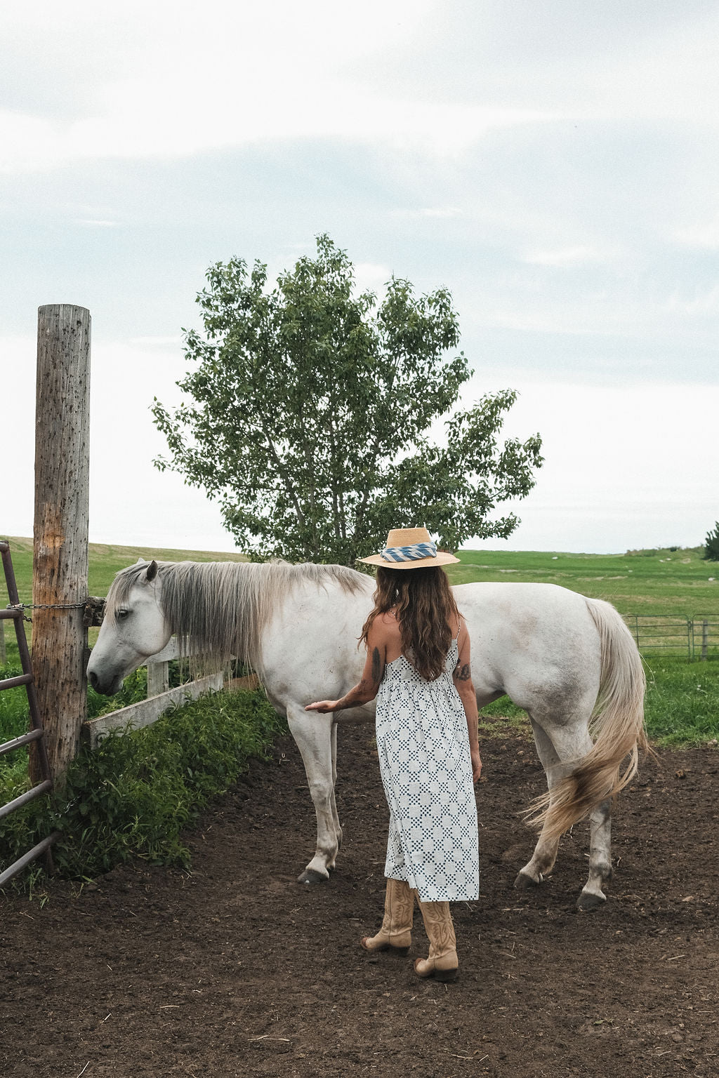 White and indigo blue hand block-printed dress made from 100% organic cotton, crafted with azo-free dyes for a soft and breathable feel. Ethically made with a lightweight, non-stretchy fabric, the dress falls 45” from the shoulder in size S and offers a true-to-size fit. Each garment is uniquely one-of-a-kind, with natural variations in color and pattern that highlight its handcrafted charm—perfect for conscious, everyday dressing.