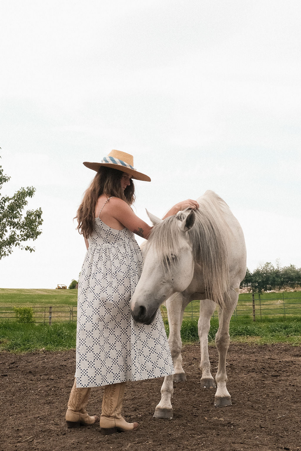 White and indigo blue hand block-printed dress made from 100% organic cotton, crafted with azo-free dyes for a soft and breathable feel. Ethically made with a lightweight, non-stretchy fabric, the dress falls 45” from the shoulder in size S and offers a true-to-size fit. Each garment is uniquely one-of-a-kind, with natural variations in color and pattern that highlight its handcrafted charm—perfect for conscious, everyday dressing.