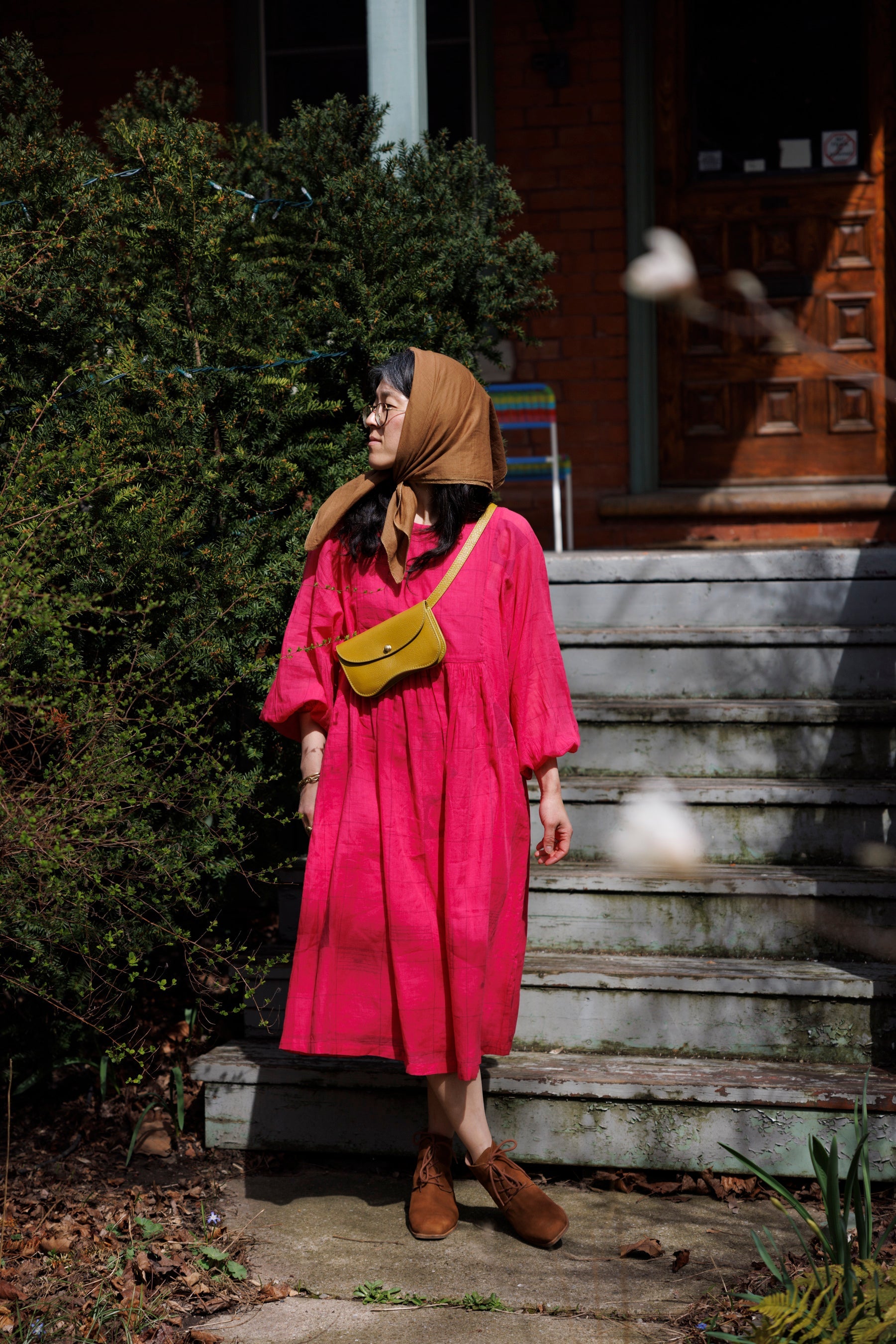 This Get Away Dress is made in a collaboration between Erica Kim @ahistoryofarchitecture and World of Crow, the dress has a scoop neck, barbie pink color, light checks in jamdani fabric