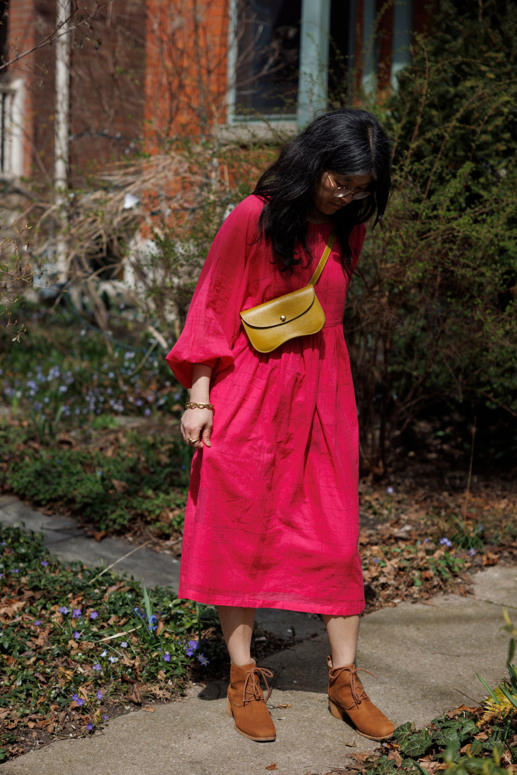 This Get Away Dress is made in a collaboration between Erica Kim @ahistoryofarchitecture and World of Crow, the dress has a scoop neck, barbie pink color, light checks in jamdani fabric