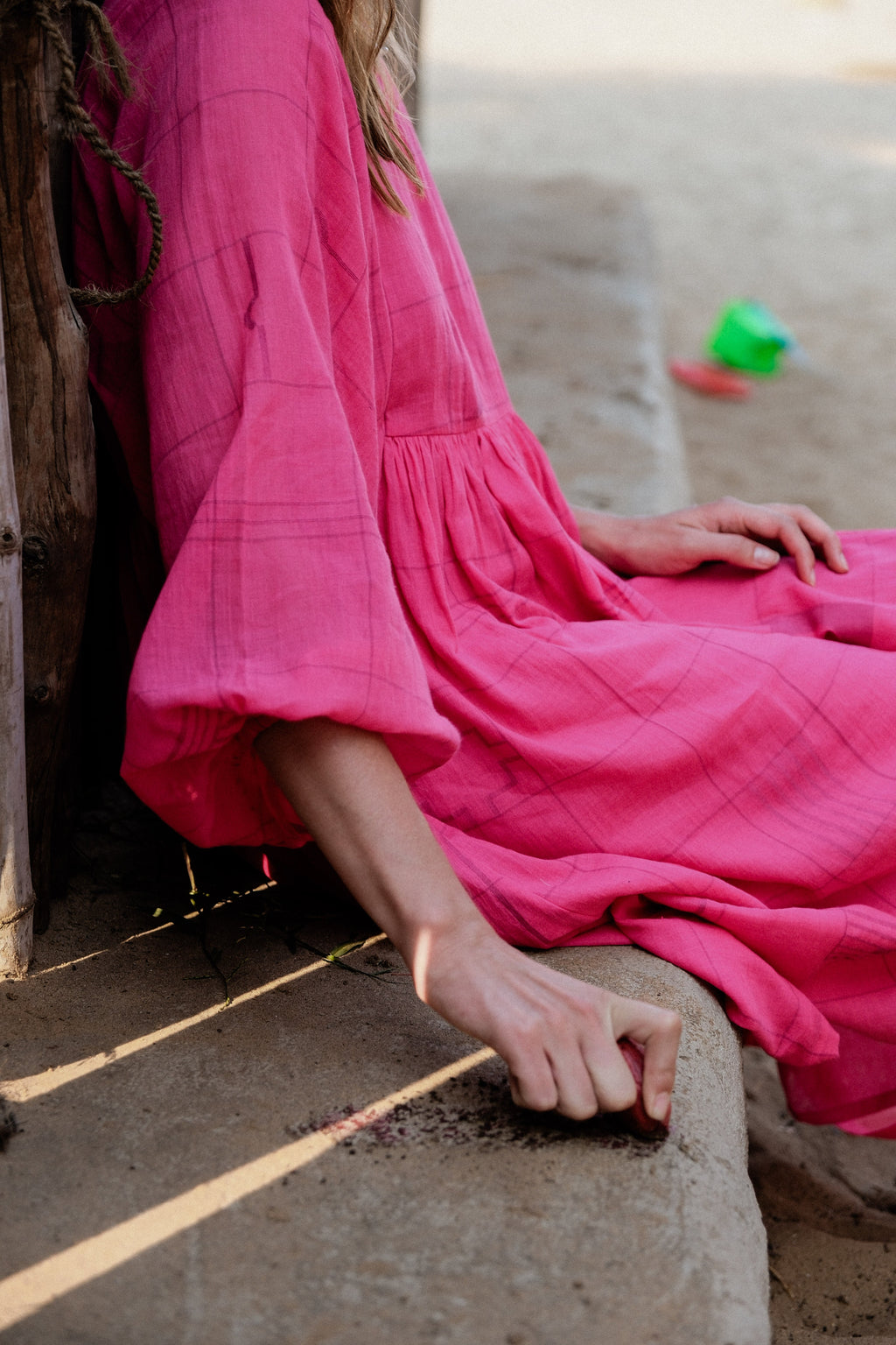 This Get Away Dress is made in a collaboration between Erica Kim @ahistoryofarchitecture and World of Crow, the dress has a scoop neck, barbie pink color, light checks in jamdani fabric