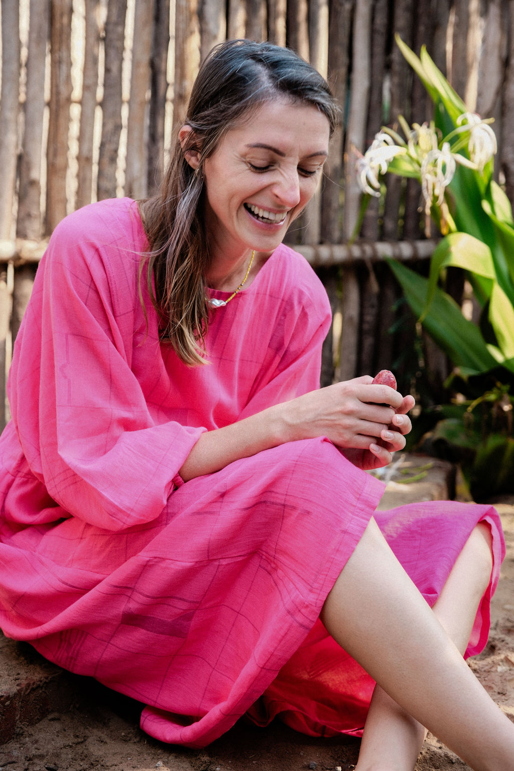 This Get Away Dress is made in a collaboration between Erica Kim @ahistoryofarchitecture and World of Crow, the dress has a scoop neck, barbie pink color, light checks in jamdani fabric