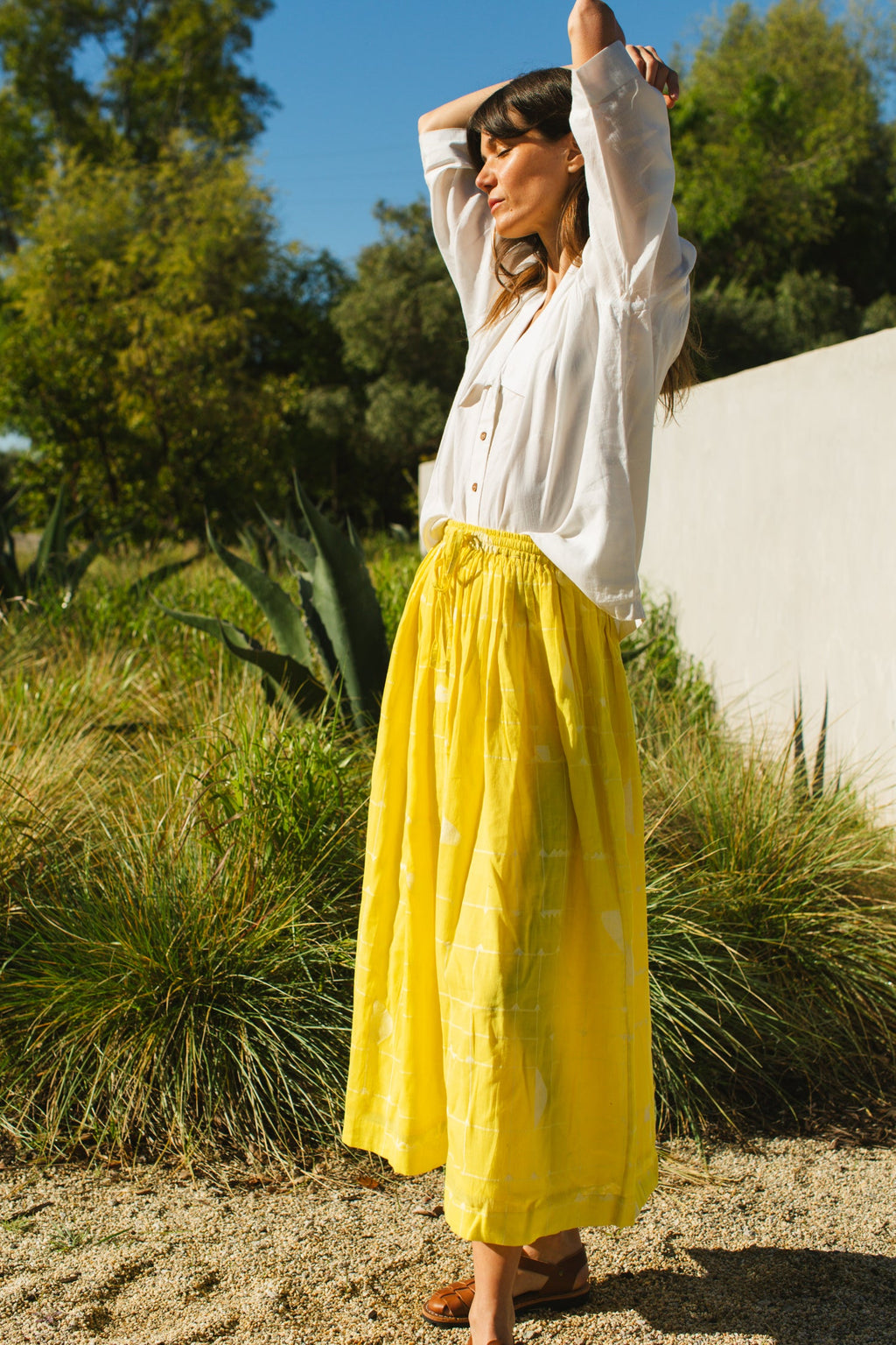 This Lemon Sorbet Skirt is made in collaboration between Erica Kim @ahistoryofarchitecture and World of Crow, it has a yellow color, checks detailing, jamdani fabric, ankle length skirt
