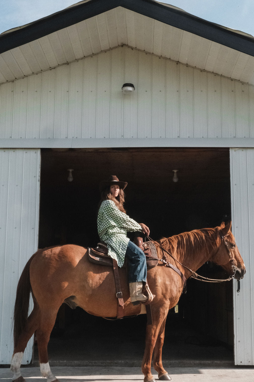 Green and white hand block-printed dress made from 100% organic cotton, featuring a front button opening and high-low hemline. Crafted over 5 days using azo-free dyes, the lightweight, non-stretchy fabric feels soft and breathable on the skin. Each piece is ethically made and uniquely one-of-a-kind, with subtle variations in print and color that highlight its artisanal nature. Falls 42” from the shoulder, offering a relaxed silhouette that fits true to size.