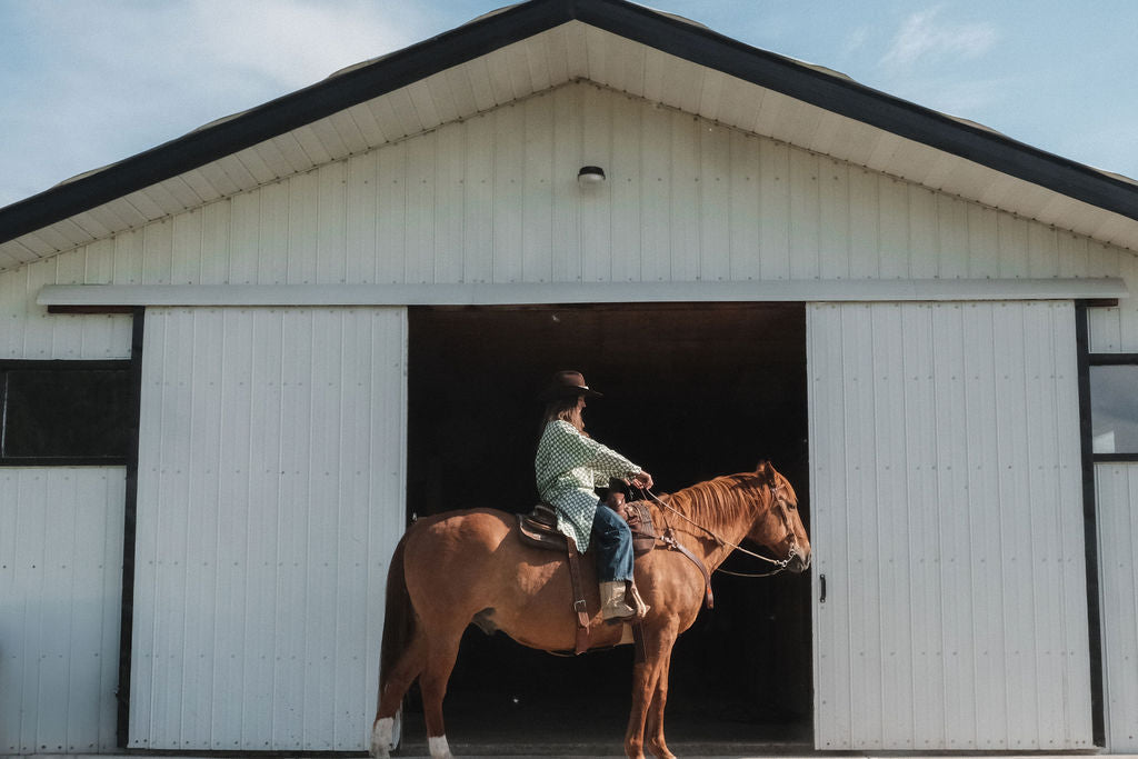 Green and white hand block-printed dress made from 100% organic cotton, featuring a front button opening and high-low hemline. Crafted over 5 days using azo-free dyes, the lightweight, non-stretchy fabric feels soft and breathable on the skin. Each piece is ethically made and uniquely one-of-a-kind, with subtle variations in print and color that highlight its artisanal nature. Falls 42” from the shoulder, offering a relaxed silhouette that fits true to size.