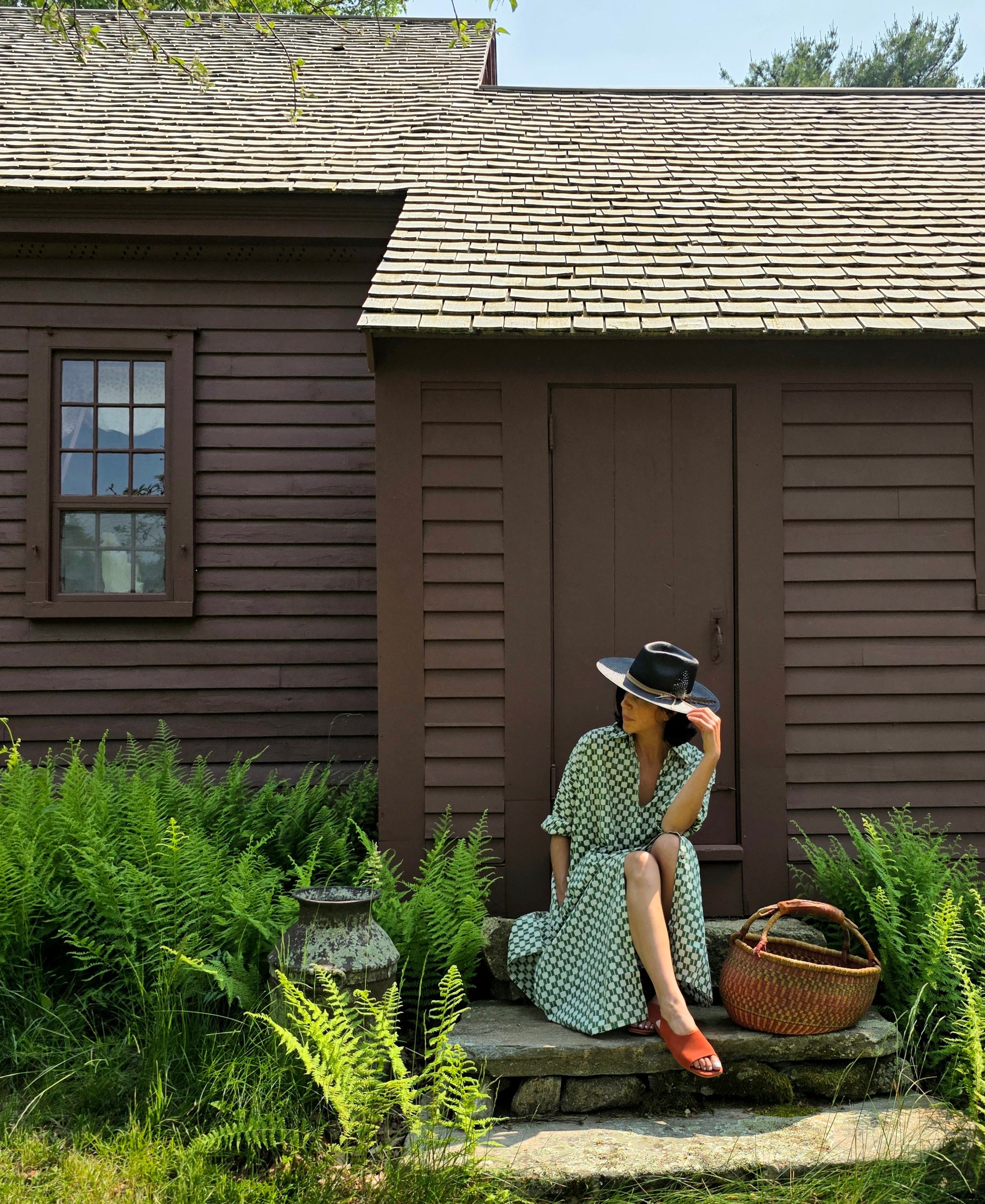 Green and white hand block-printed dress made from 100% organic cotton, featuring a front button opening and high-low hemline. Crafted over 5 days using azo-free dyes, the lightweight, non-stretchy fabric feels soft and breathable on the skin. Each piece is ethically made and uniquely one-of-a-kind, with subtle variations in print and color that highlight its artisanal nature. Falls 42” from the shoulder, offering a relaxed silhouette that fits true to size.