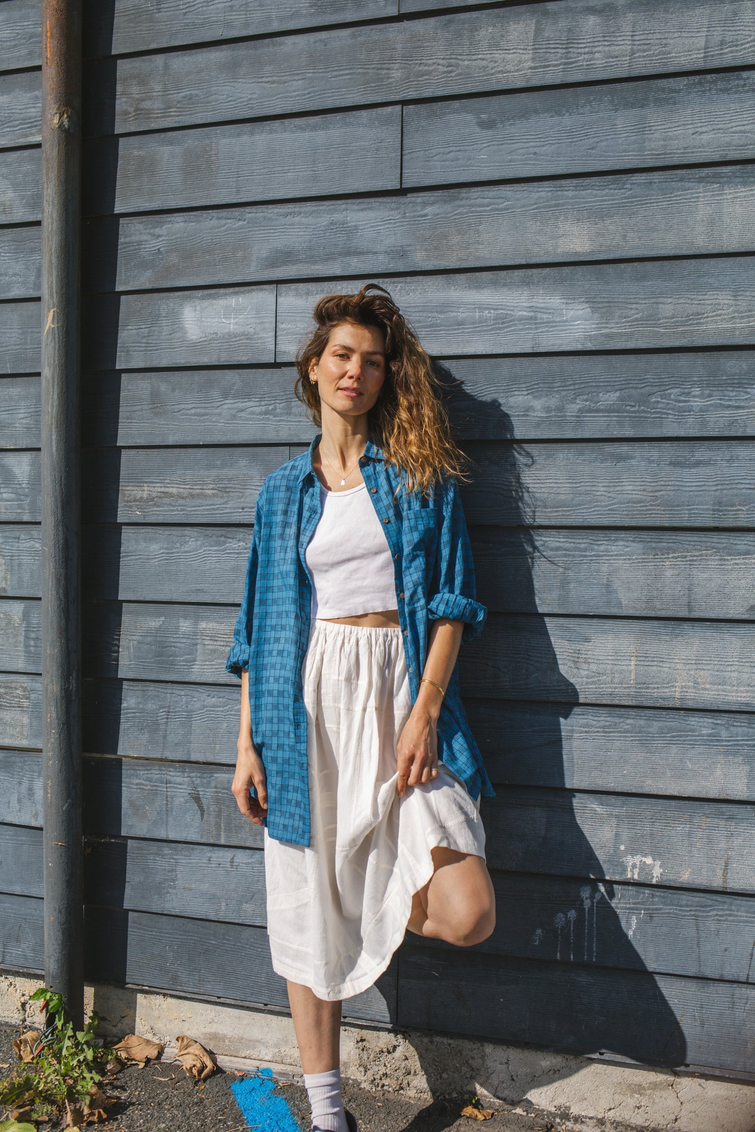 Blue long-sleeve button-down shirt with a subtle textured pattern. Features a classic pointed collar and a relaxed fit, perfect for effortless styling. Made from breathable fabric for all-day comfort. Ideal for casual and semi-formal looks.