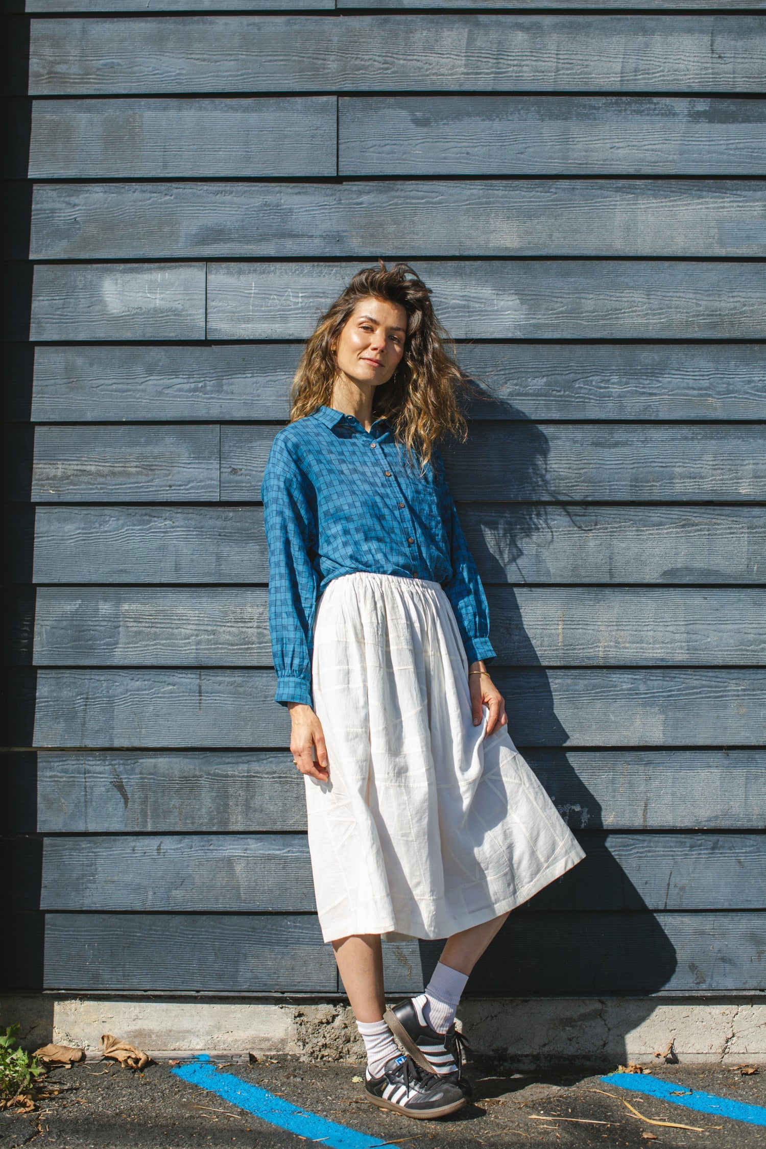 Blue long-sleeve button-down shirt with a subtle textured pattern. Features a classic pointed collar and a relaxed fit, perfect for effortless styling. Made from breathable fabric for all-day comfort. Ideal for casual and semi-formal looks.