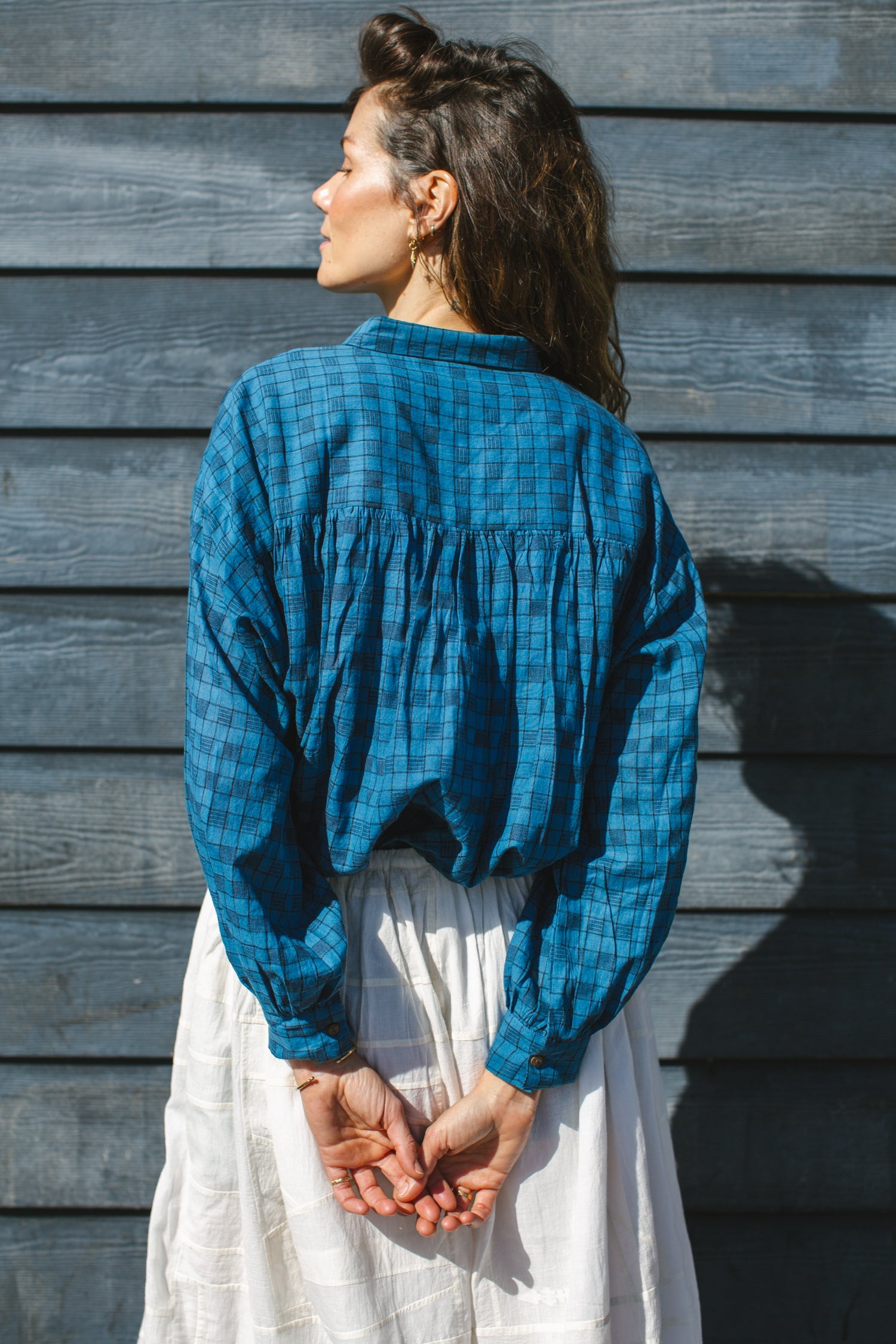 Blue long-sleeve button-down shirt with a subtle textured pattern. Features a classic pointed collar and a relaxed fit, perfect for effortless styling. Made from breathable fabric for all-day comfort. Ideal for casual and semi-formal looks.