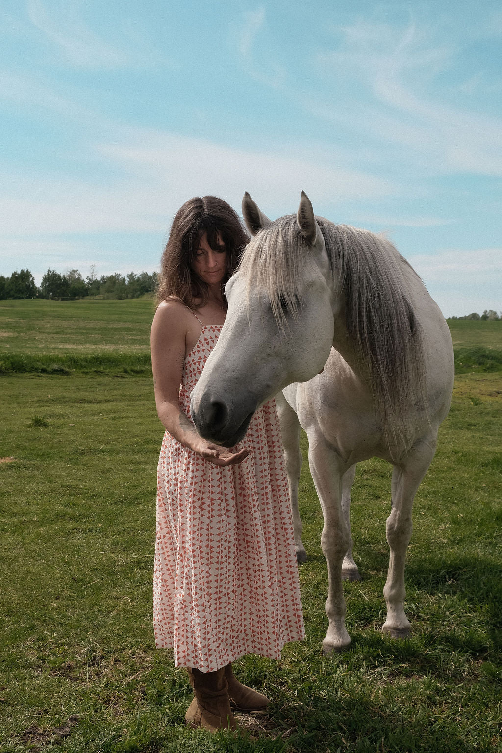 This is dress is the quintessential example of a sundress - perfect for get-outs and adventures. The flowy garment is made with azo free dye with tiny red triangle on a white base. Each triangle being unique as printed by a hand block. 