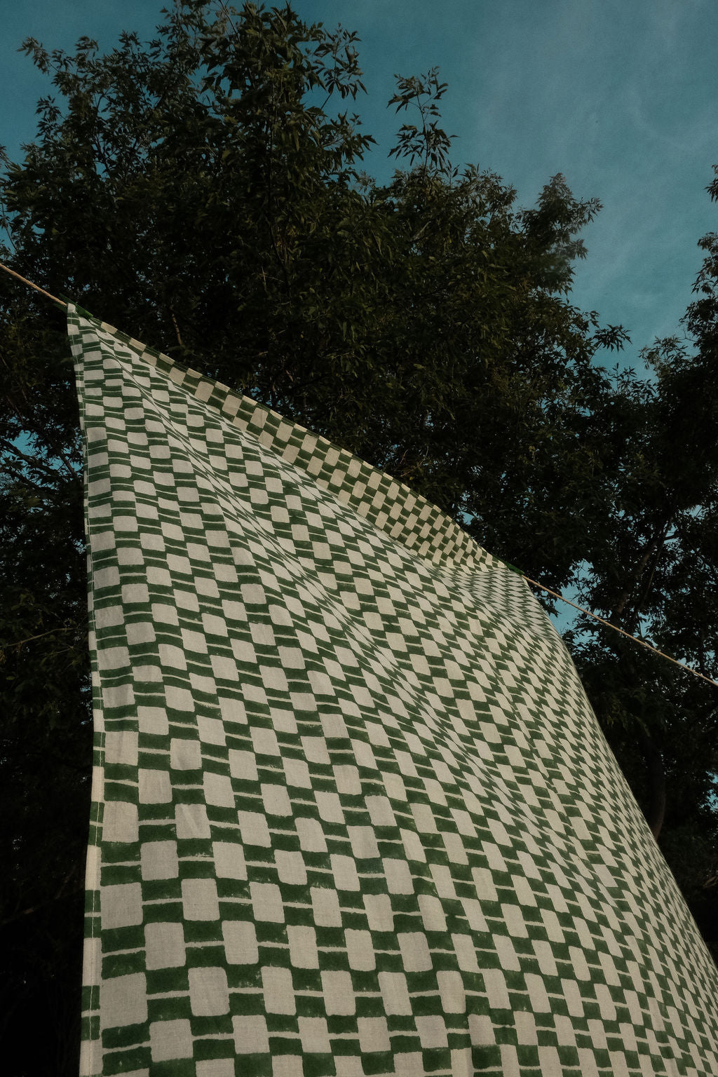 Handwoven green and white checkered cotton bandana by World of Crow, ethically crafted in India using traditional weaving techniques – sustainable and artisanal accessory for conscious fashion lovers