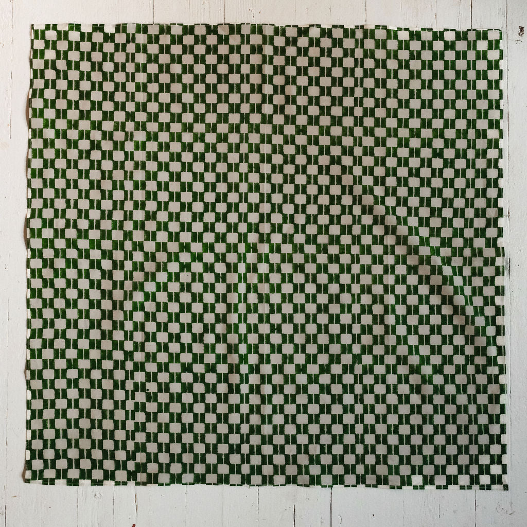 Handwoven green and white checkered cotton bandana by World of Crow, ethically crafted in India using traditional weaving techniques – sustainable and artisanal accessory for conscious fashion lovers