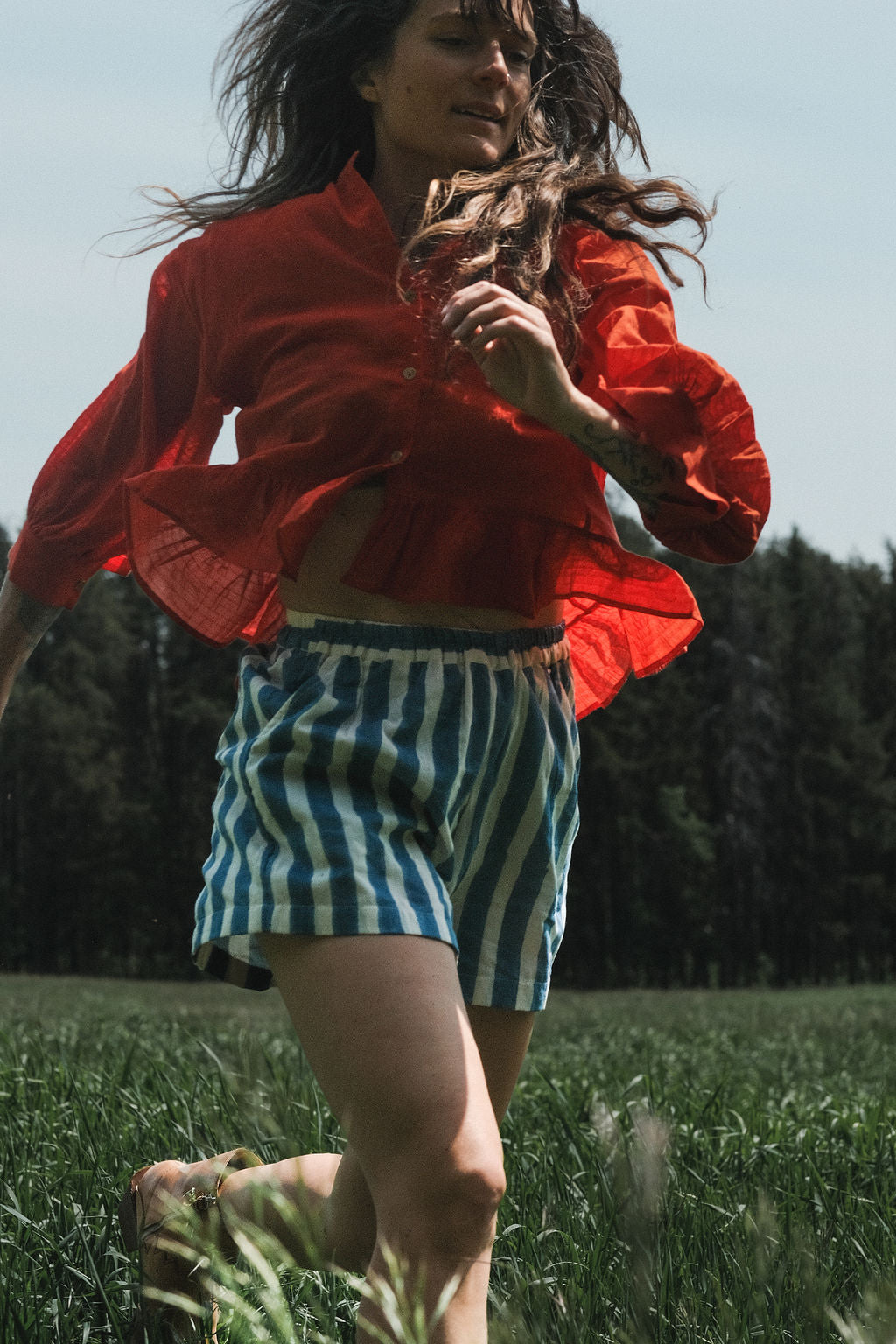 These shorts are perfect for everyday wear, has side pockets, made with soft organic fabric, in striped blue & white color. 