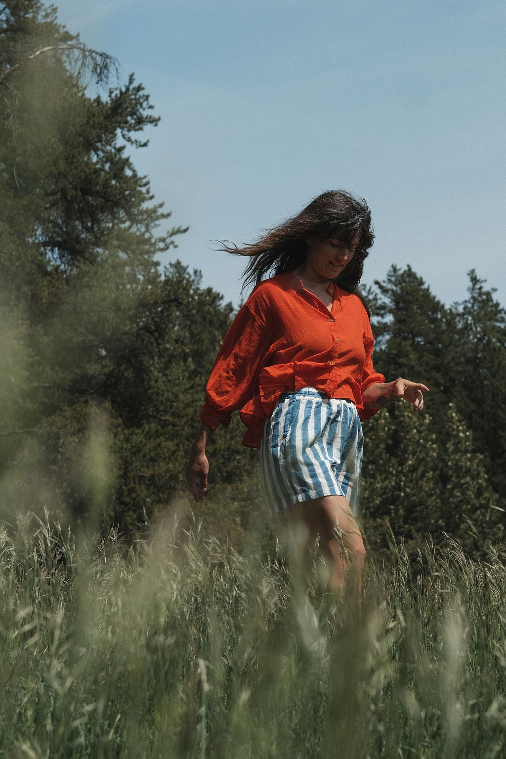 These shorts are perfect for everyday wear, has side pockets, made with soft organic fabric, in striped blue & white color. 