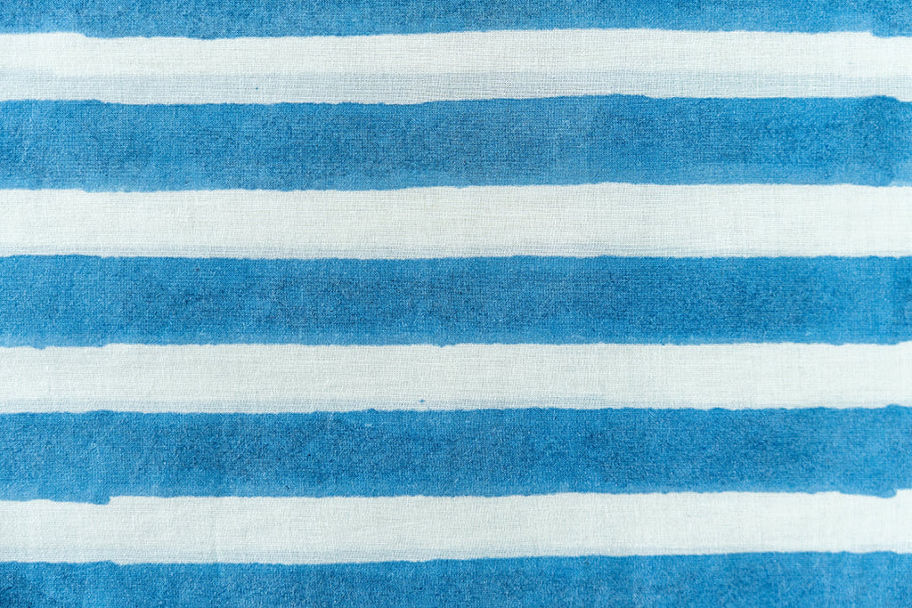 Made with natural dyes, hand woven cotton. Fabric is lightweight and soft.