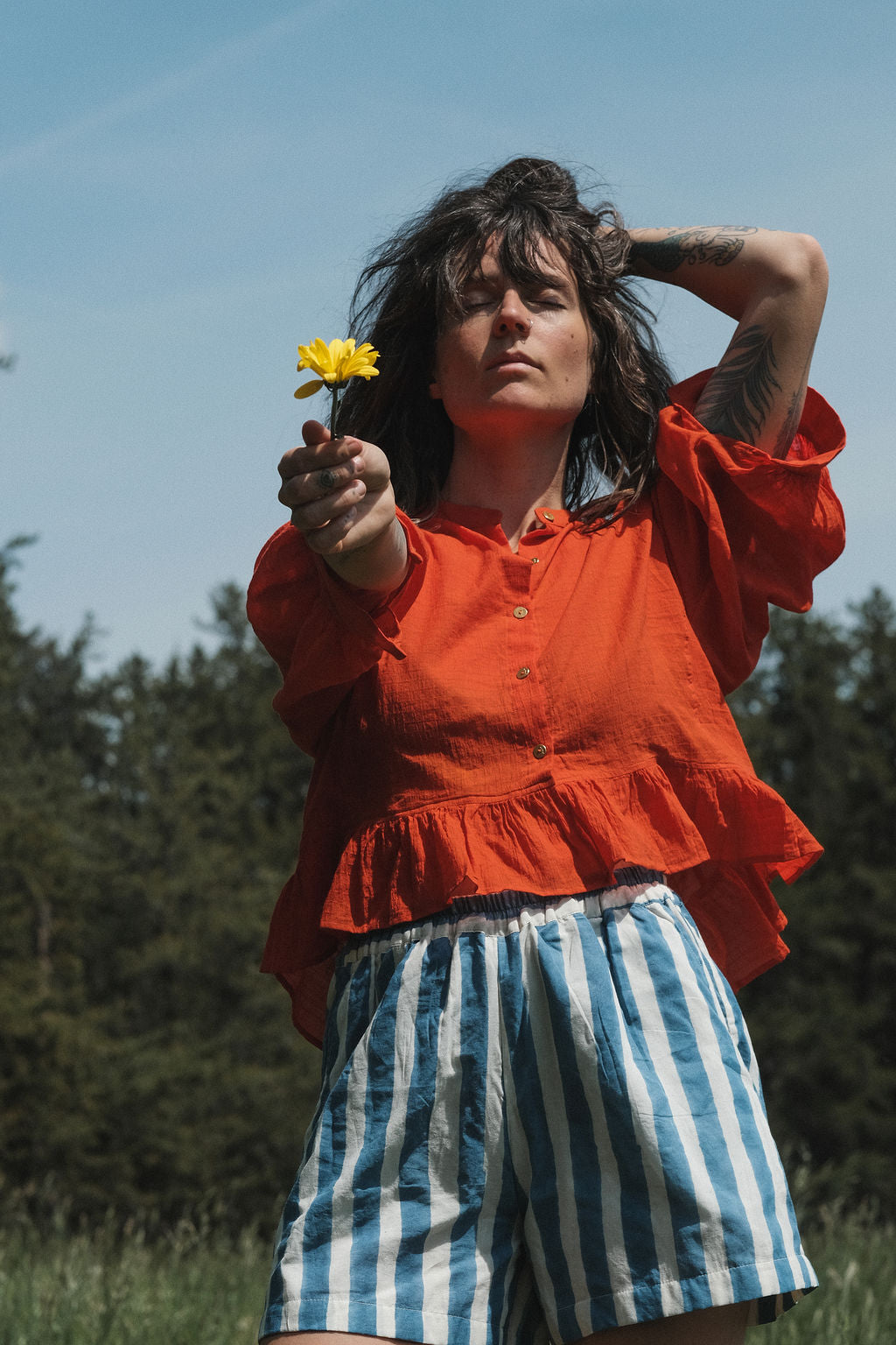 These shorts are perfect for everyday wear, has side pockets, made with soft organic fabric, in striped blue & white color. 